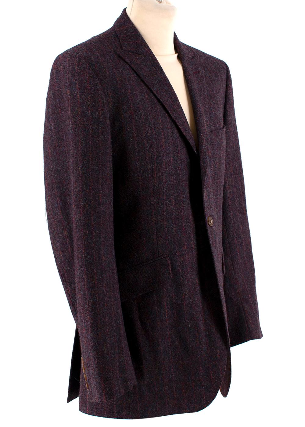 Ozwald Boateng Burgundy Wool Single Breasted Suit 

-Made of a soft wool fabric 
-Gorgeous stripes like pattern 
-Classic single breasted cut 
Jacket:
-3 pockets to the front 
-Button fastening to the from 
-Fully lined 
-3 inner pockets 
-Buttoned