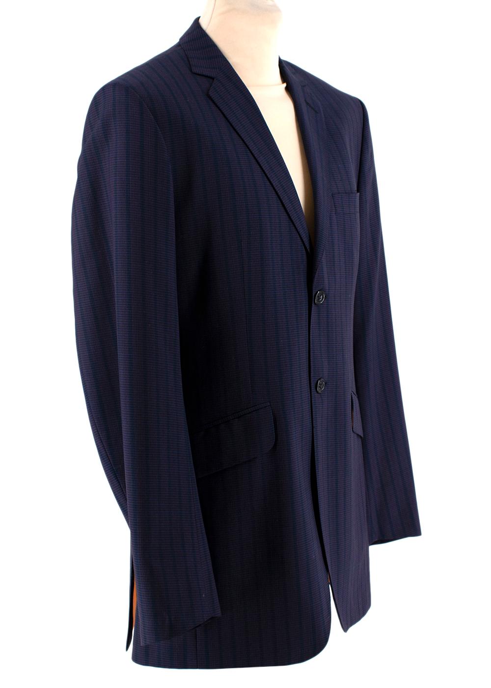 Ozwald Boateng Red & Blue Striped Wool Single Breasted Suit

-Made of soft lightweight wool 
-Gorgeous striped pattern 
-Classic single breasted cut 
Jacket:
-3 pockets to the front 
-Button fastening to the from 
-Fully lined 
-3 inner pockets