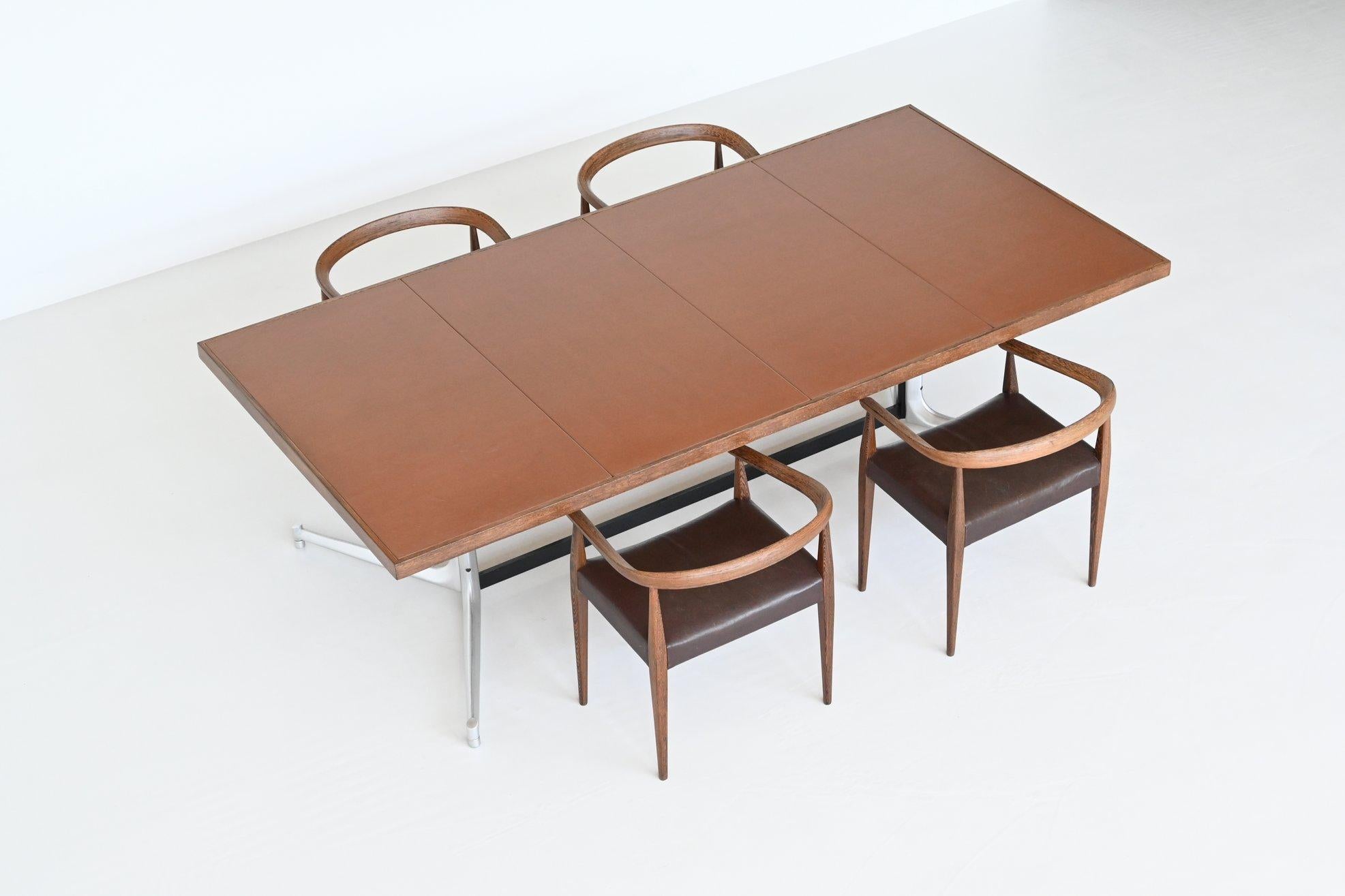 Stunning large dining or conference table designed by Preben Fabricius and Jørrgen Kastholm, manufactured by Kill International, Germany 1970. This striking table has a solid brushed steel base which consists of 4 legs connected in the middle by two