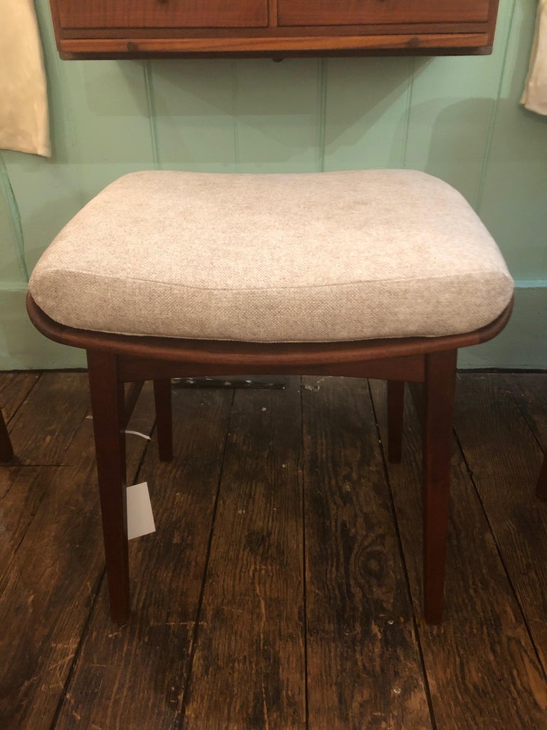 Authentic midcentury designer bench or stool by P Jensen, Denmark, circa 1960. The sleek teak base is classic Danish modern. Newly upholstered attached plush seat cushion.