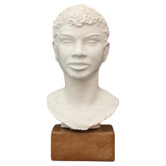 P. L. Agassiz  Young moor bust in terracotta (42x18x21cm)  Signed, dated 1944