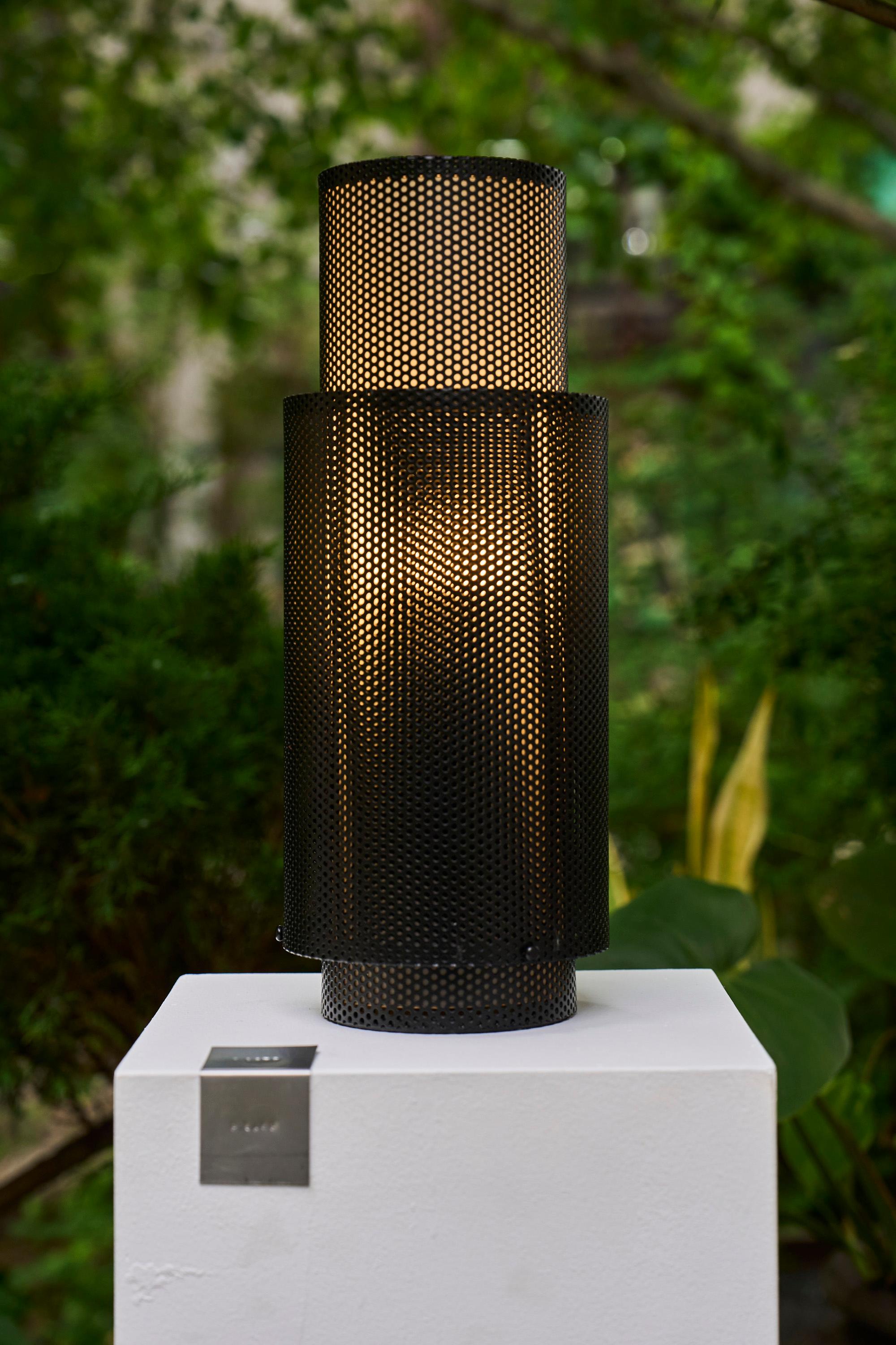 A composition of intersecting cylinders, the P-Lamp creates a dynamic moiré effect as light filters through its perforated volumes.

Rooted in a family tradition of metalsmithing, the P-Lamp was first prototyped in our sheet metal workshop in