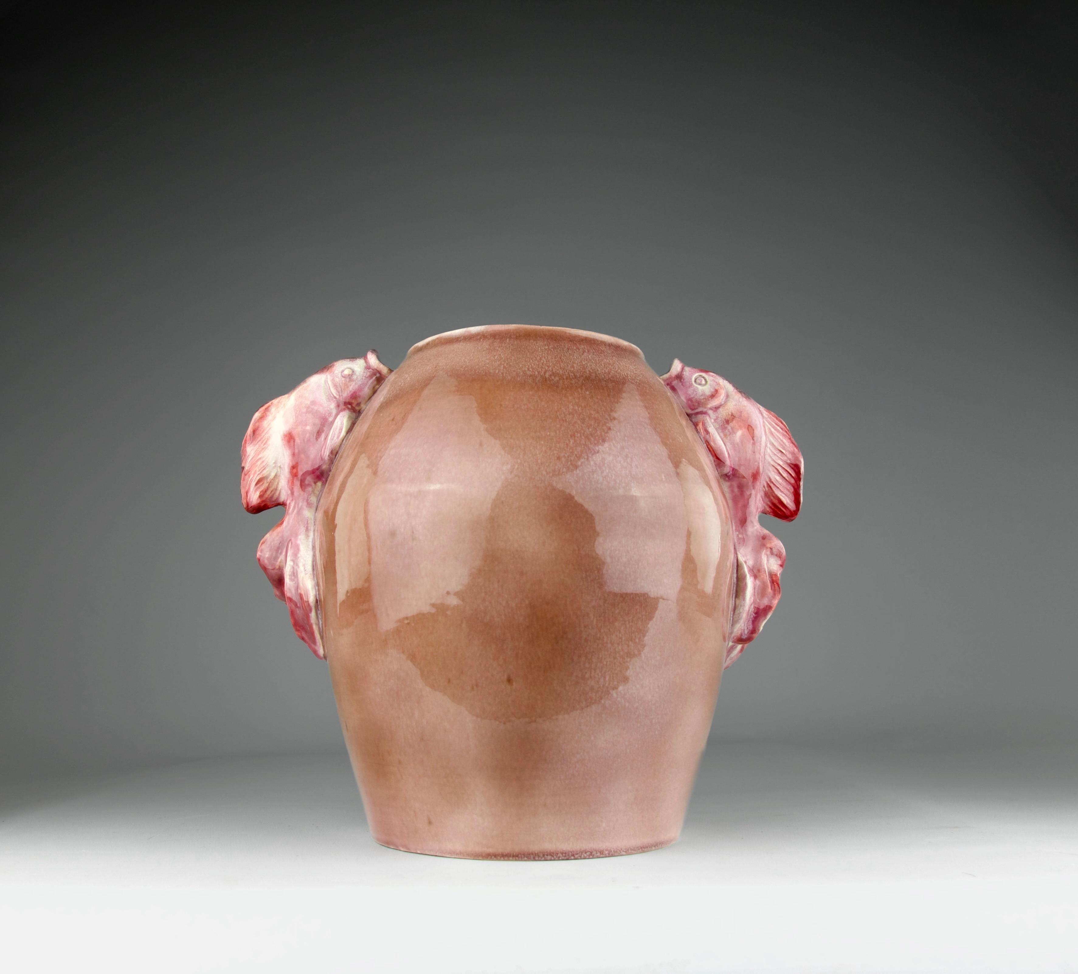 Superb and exceptional vase by P. Letessier, also a collaborator of René Meynial another Art Deco ceramicist. Vase with pink and red hues with decorations of beautiful goldfish handles.

Signed P. Letessier and numbered 1011.

Dimensions in cm (