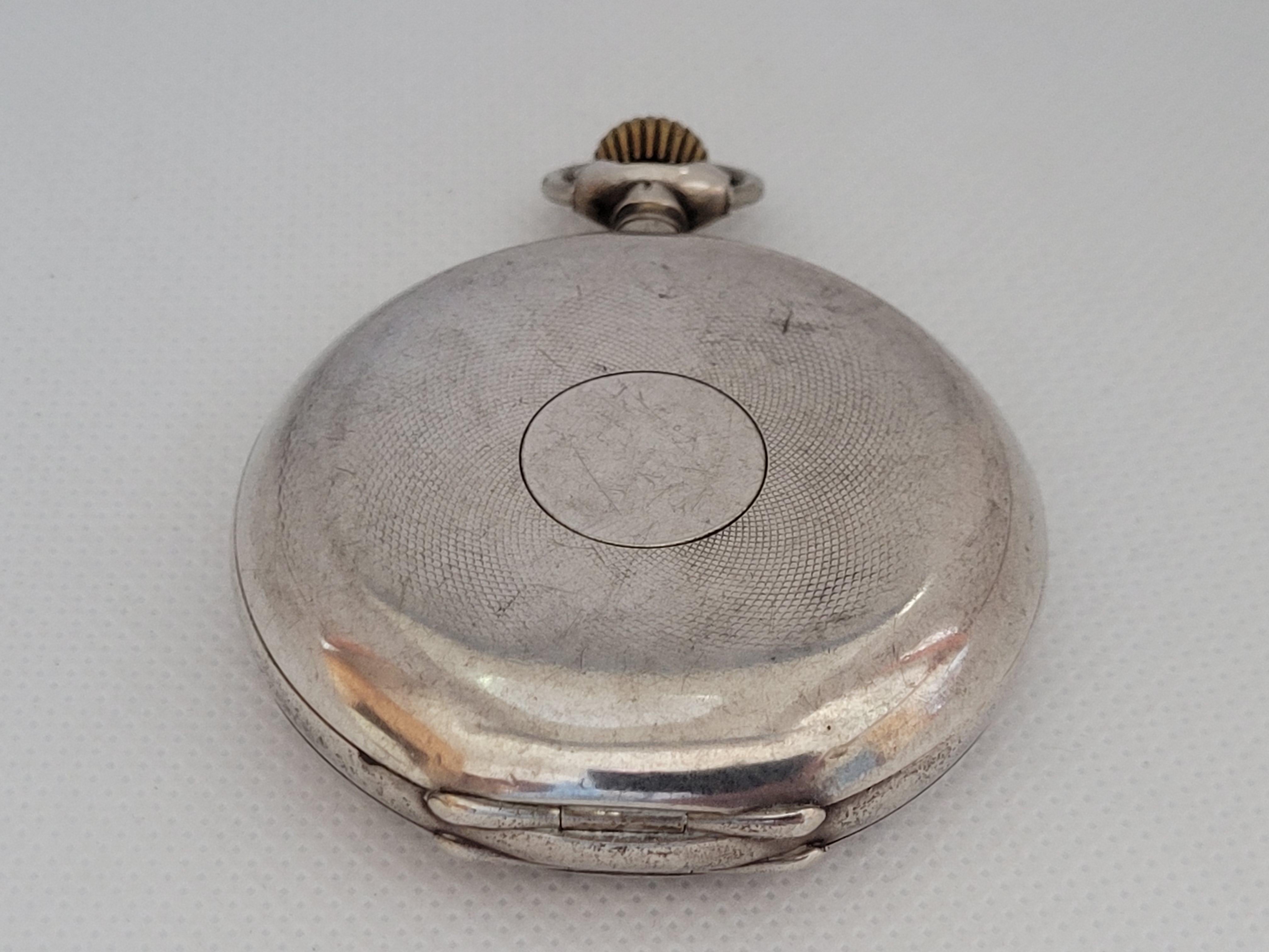 P. Moser 875 silver pocket watch that has a 51mm case, 13.5mm thick, with a clean plastic crystal. The manual movement is working with serial number 176469. Overall, this pocket watch is in very nice condition with slight blemishes.  

Although this