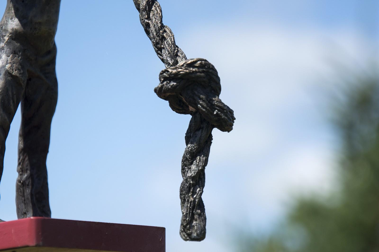 Canadiana: Tug of War - tall, narrative, figurative, male bronze sculpture - Gold Figurative Sculpture by Roch Smith