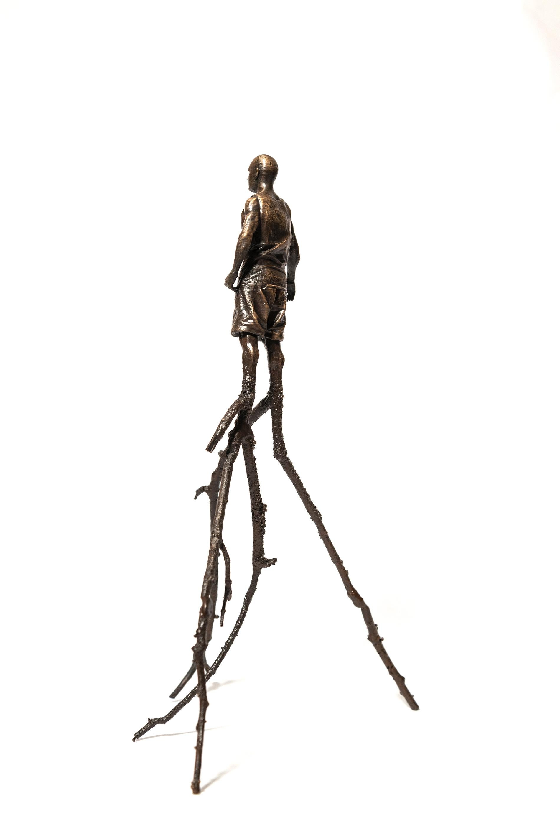Roch Smith’s ‘Tree Man’ series of bronze tabletop sculptures are playful pieces that feature figures whose human limbs have been replaced by tree branches. This figure is dressed for summer in a tank top and shorts; only his legs have been replaced