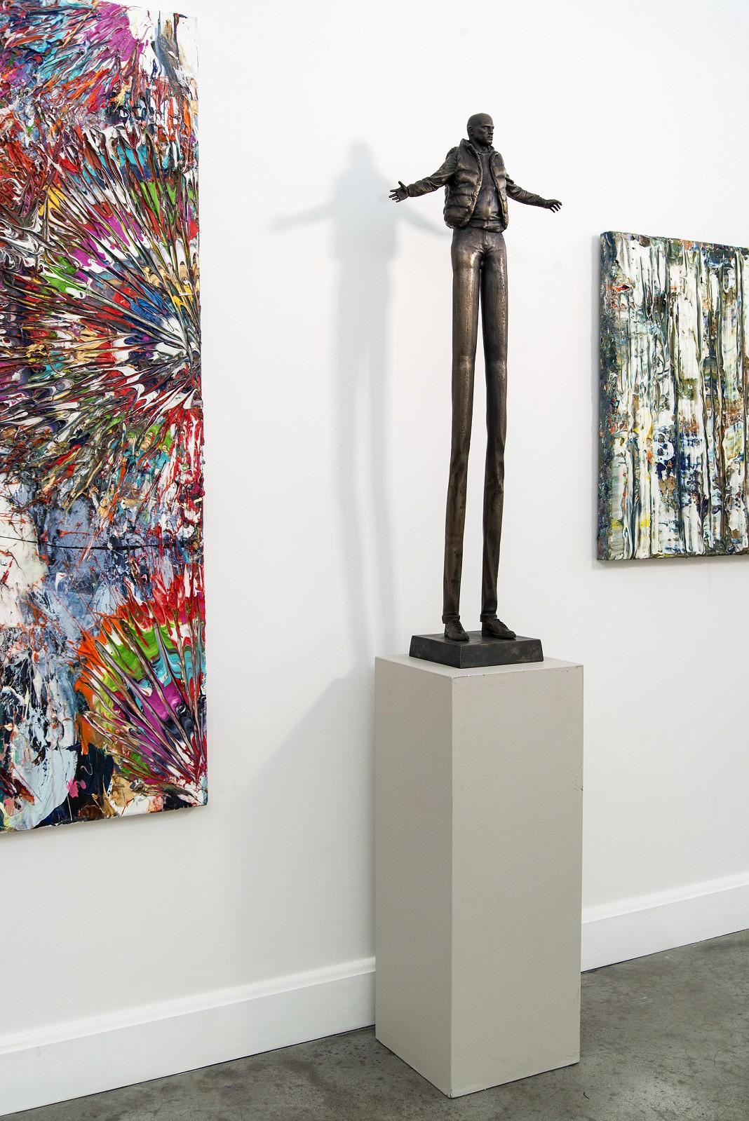 Enlarging Perspective - Surreal stretched male figure in bronze - Gold Figurative Sculpture by Roch Smith