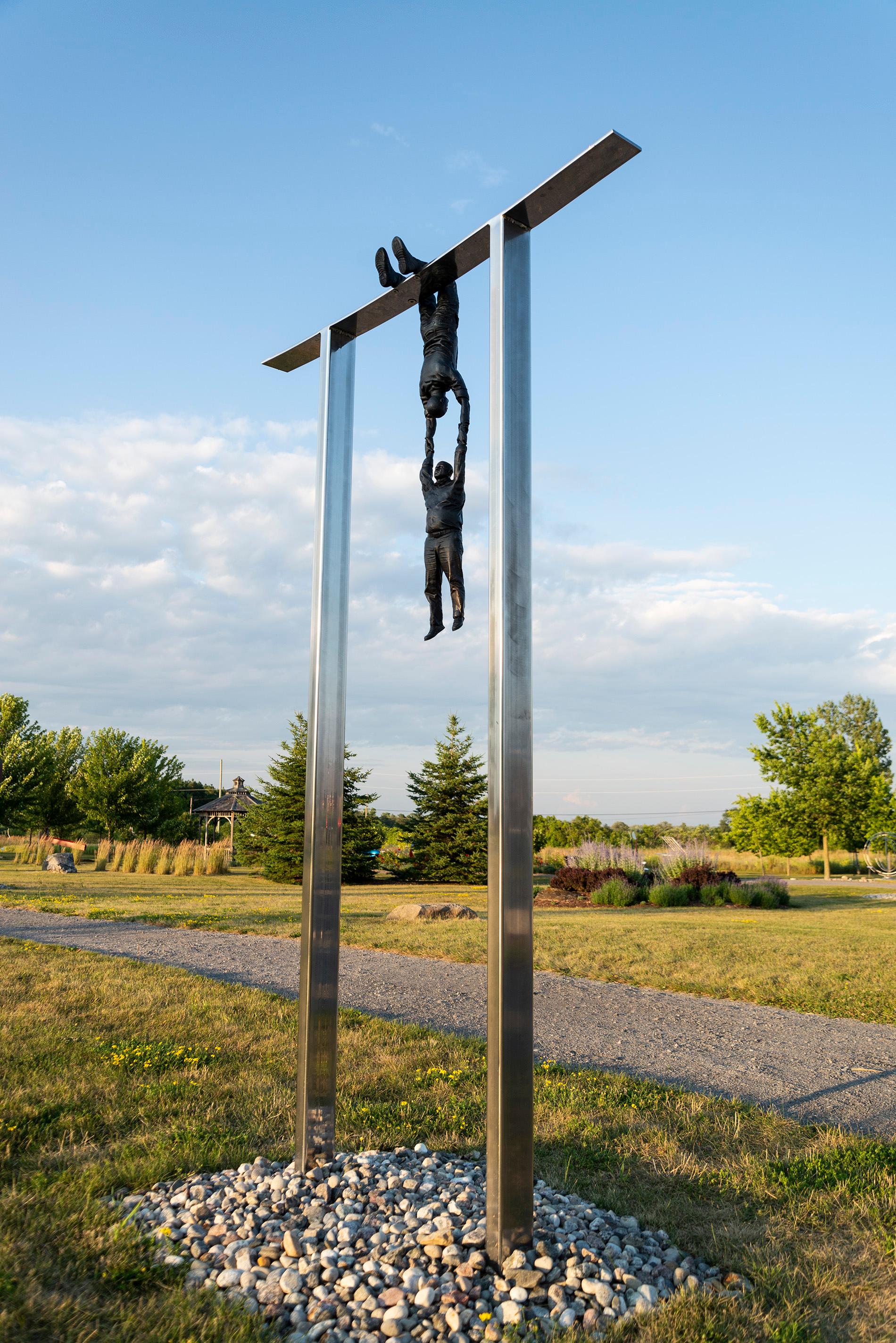 Hold Fast - tall, surrealist, male, figurative, bronze, steel, outdoor sculpture 7