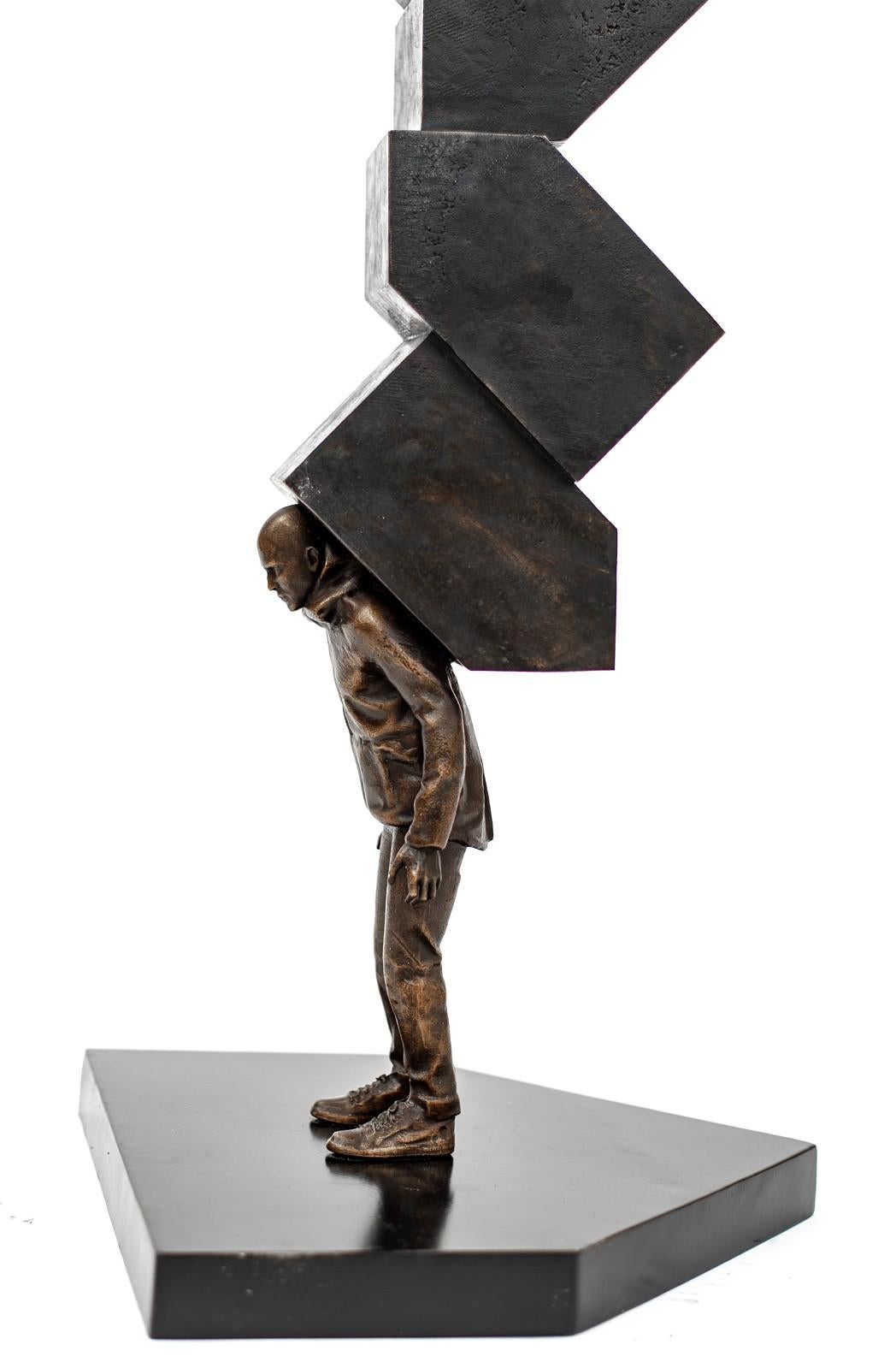 Memory Houses - Patinated male figure and stacked shaped houses