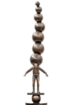 Semblance of Balance - Bronze casted male figure with stacked spheres