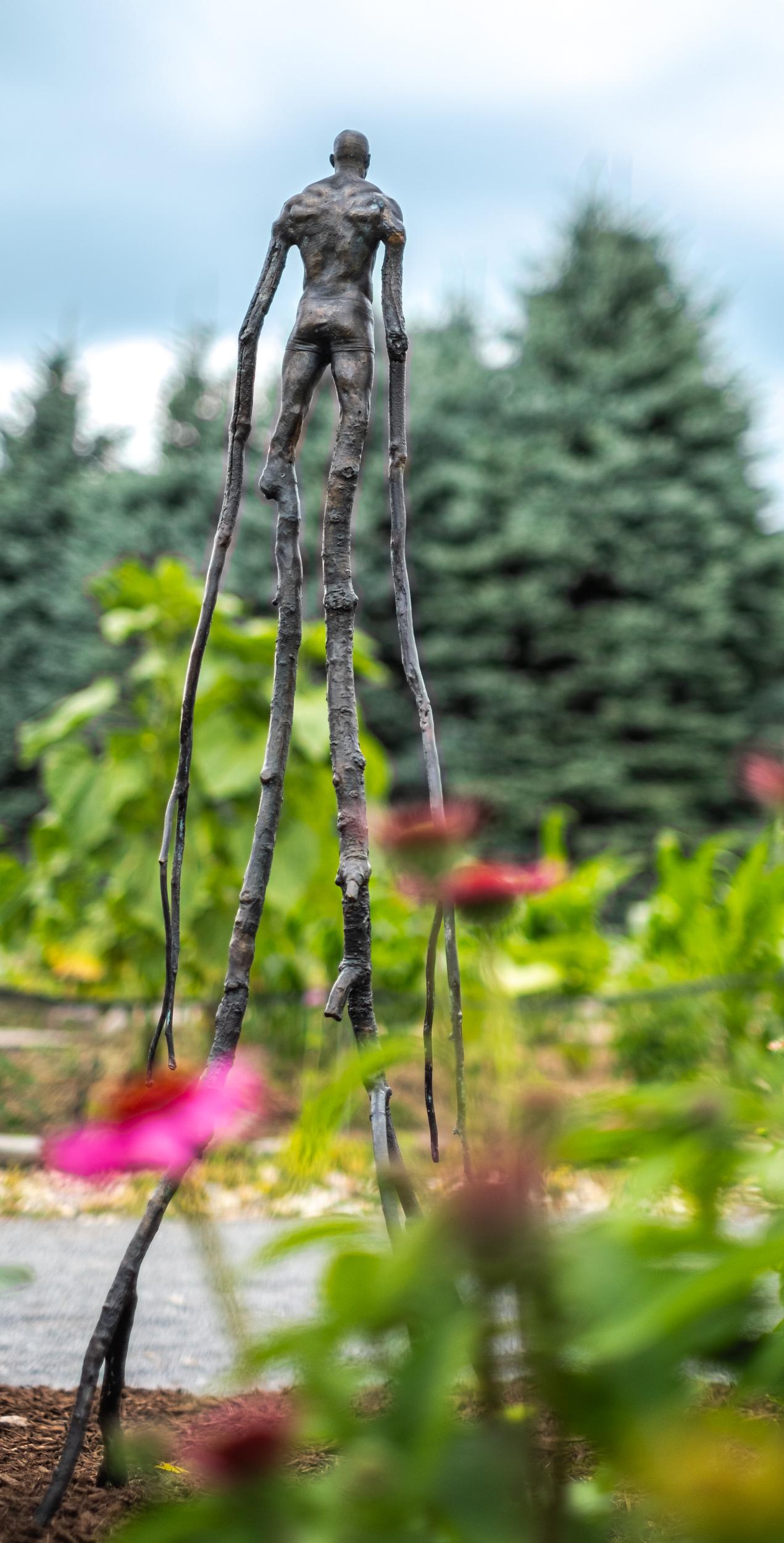 Wanderer - surrealist, contemporary, figurative, bronze, outdoor sculpture - Gold Figurative Sculpture by Roch Smith