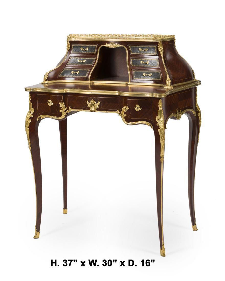 Exquisite French Louis XV style ormolu-mounted Mahogany Cartonnier ladies desk by Paul Sormani, late 19th century.

The beautiful bombe cartonnier is surmounted by an ormolu gallery and fitted with six small shaped tooled leather drawers, centered