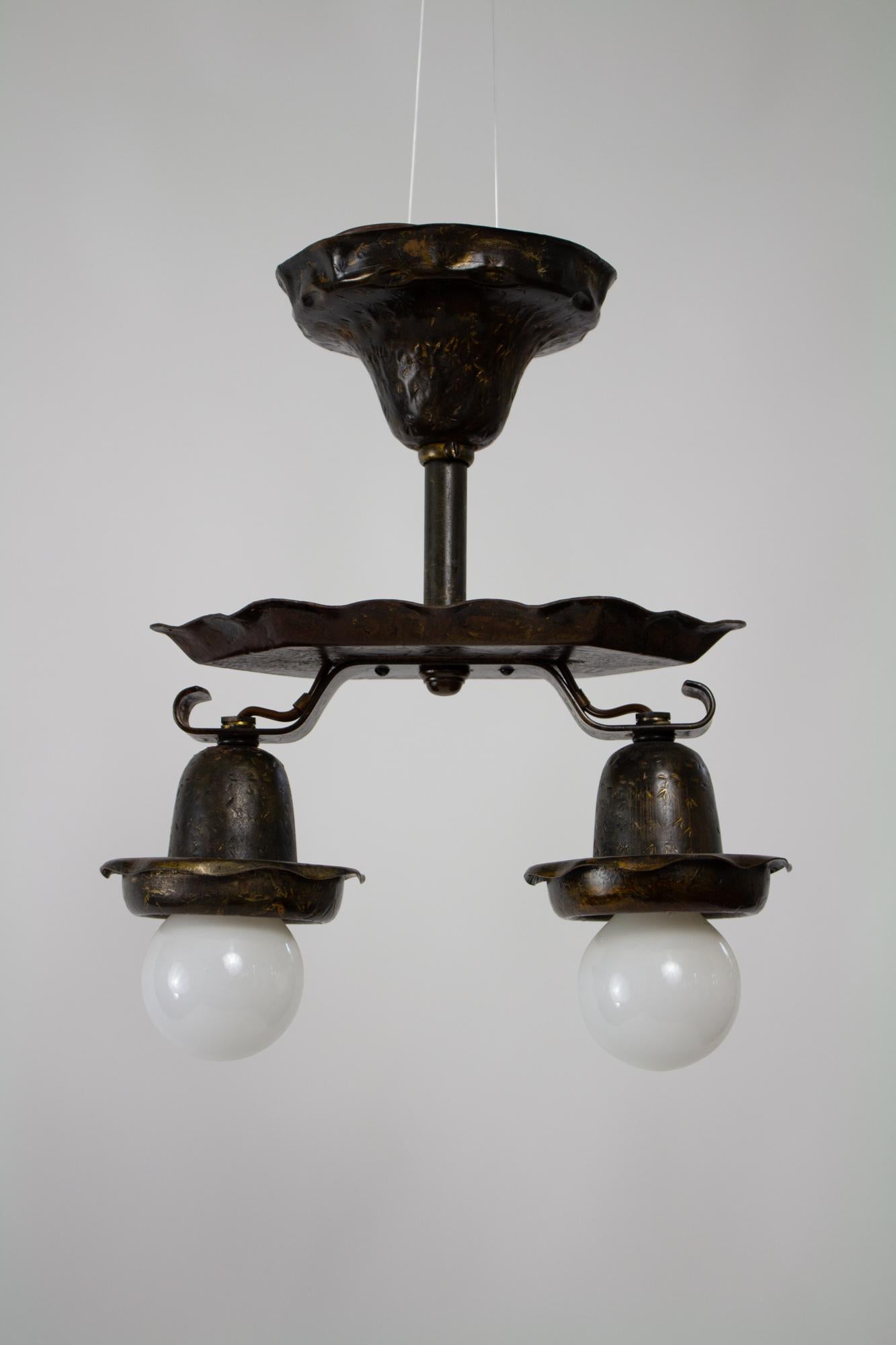 Two light exposed bulb fixture. Flush mount. Original antiqued painted finish, cleaned.  Rewired and setup for installation to modern US electrical box. Attributed to E. F. Caldwell. American, C. 1915.

