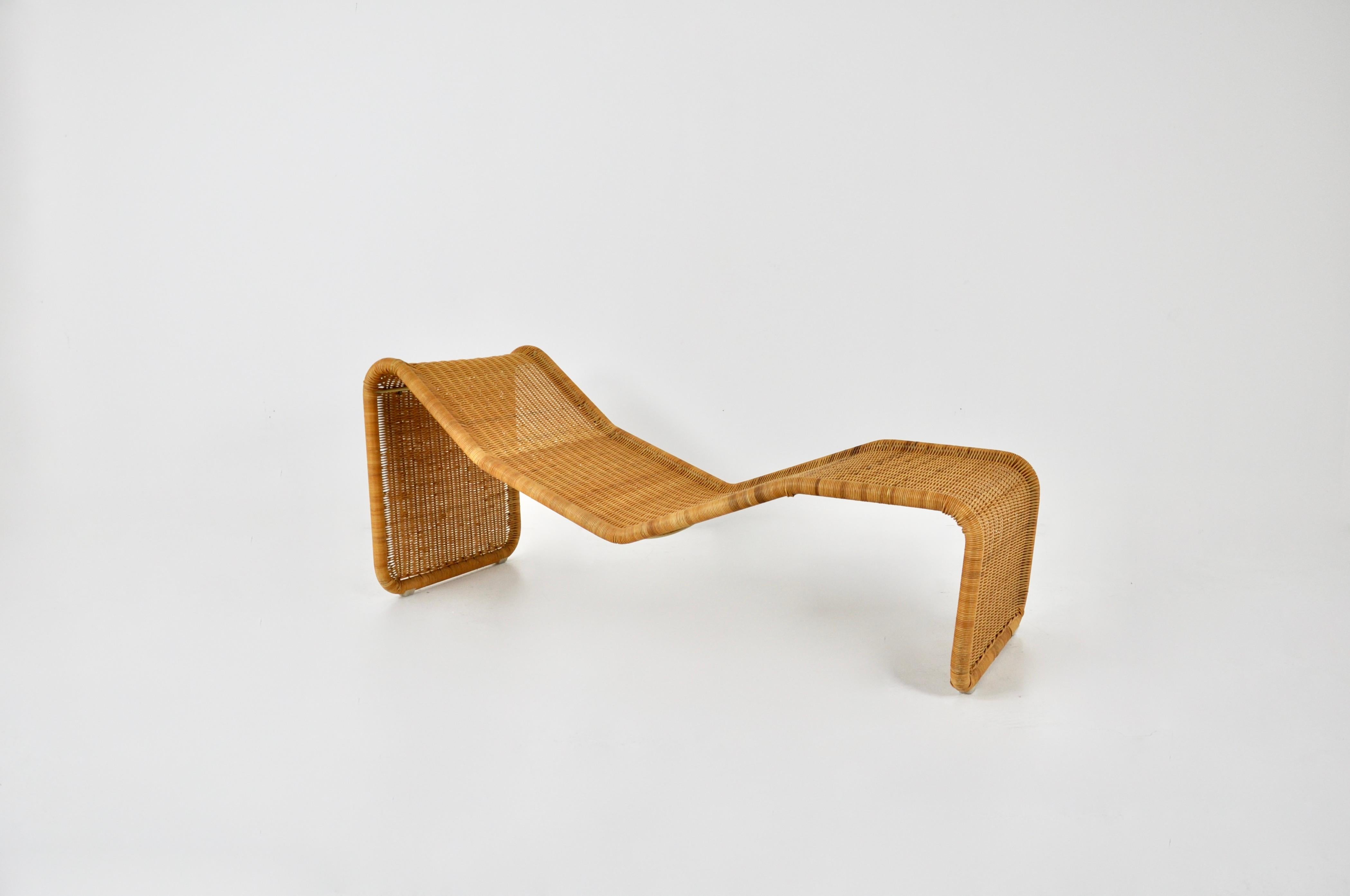 Rattan lounge chair by Tito Agnoli. Wear due to time and age.