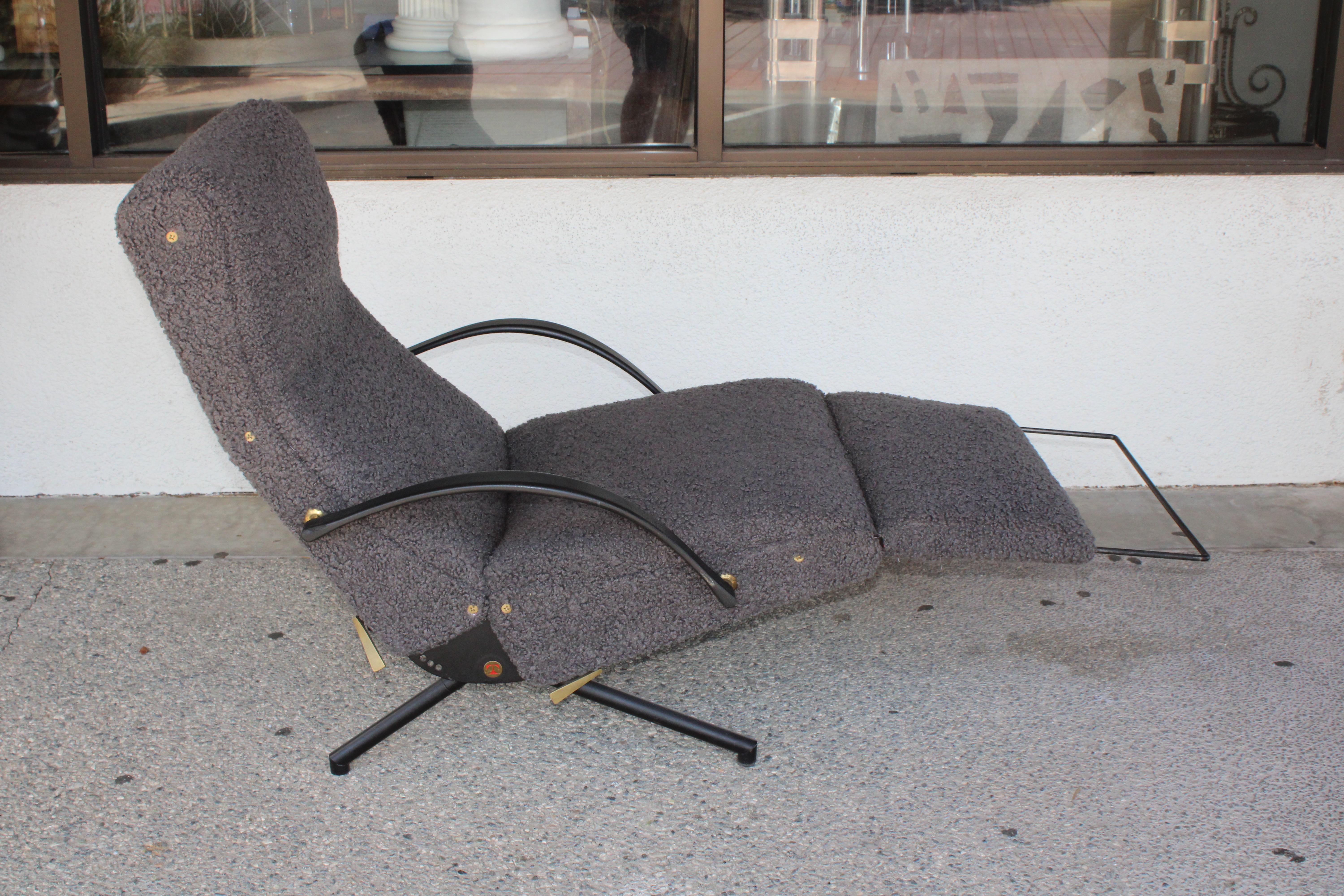 P40 lounge chair designed by Osvaldo Borsani for Tecno. The lounge, with an extendable footrest, is designed to recline be adjusted in many different positions depending on the user’s preferences.  We believe the upholstery has been replaced. Chair