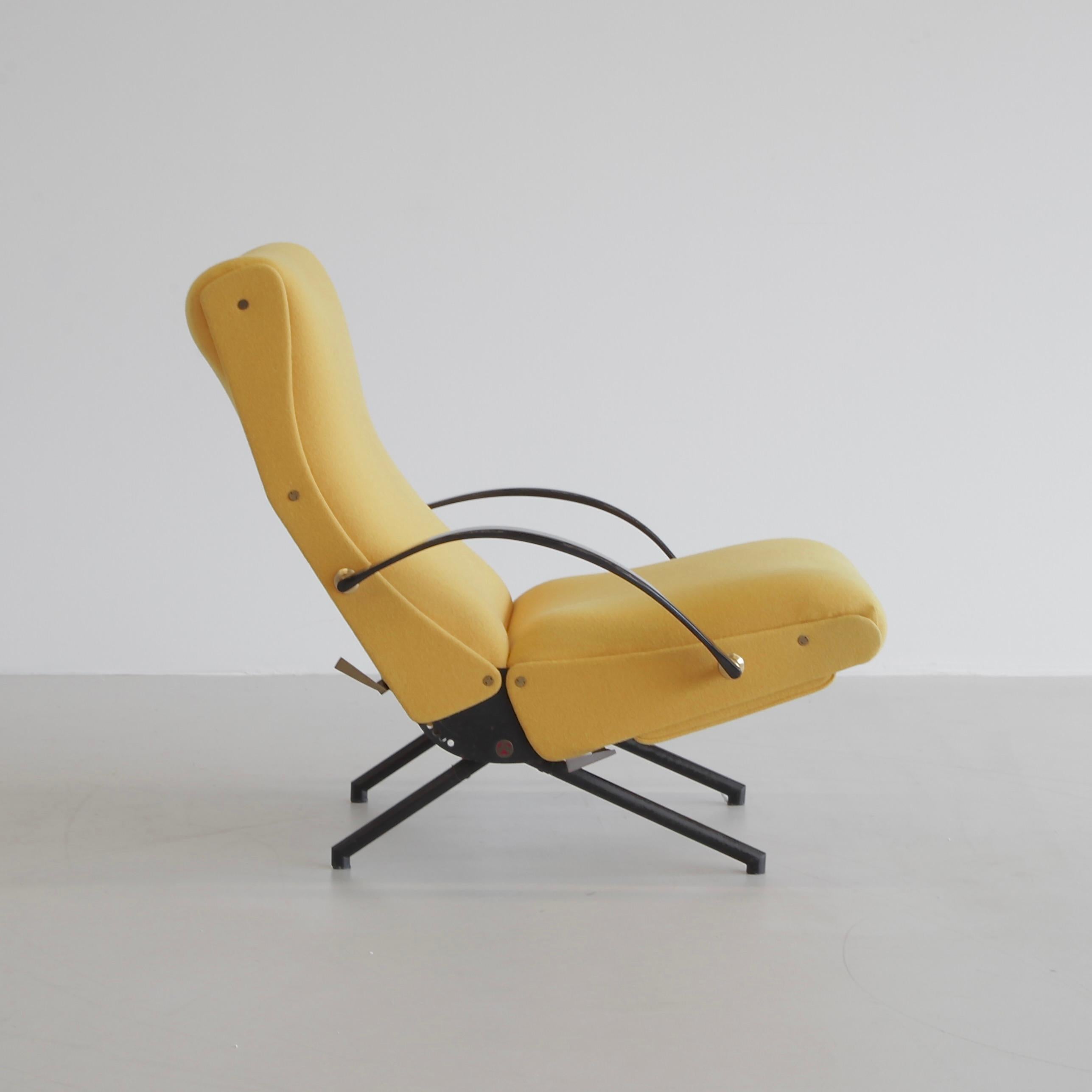 The 'P40' variable tilt armchair, produced by Tecno, Milan 1956.

Black tubular frame with rubber armrests. The seat, back and footrest are upholstered in yellow wool material. The footrest is stored under the seat. Brass detail. New flexible