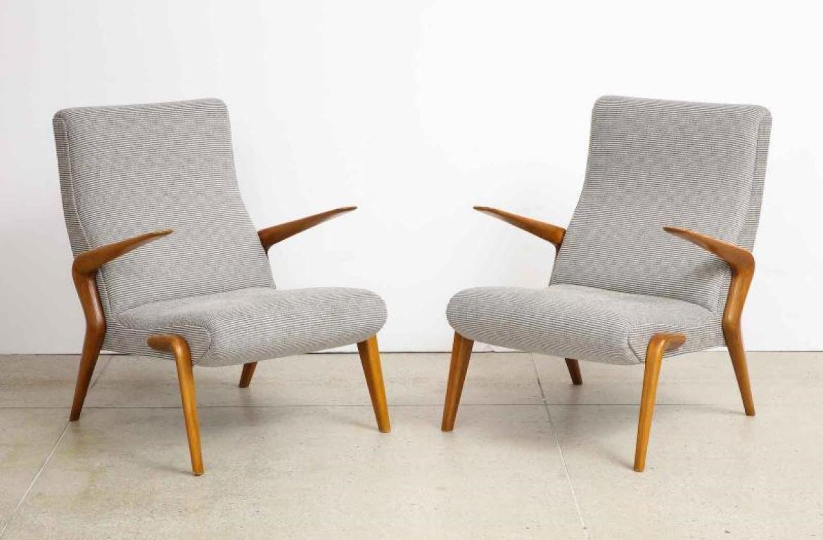 P71 Lounge Chairs by Osvaldo Borsani for Tecno.  Open arm lounge chairs of bleached walnut and upholstered seat and back. Wood has recently been refinished and newly upholstered seats.
Provenance: Private Collection Bergamo
Published: Osvaldo