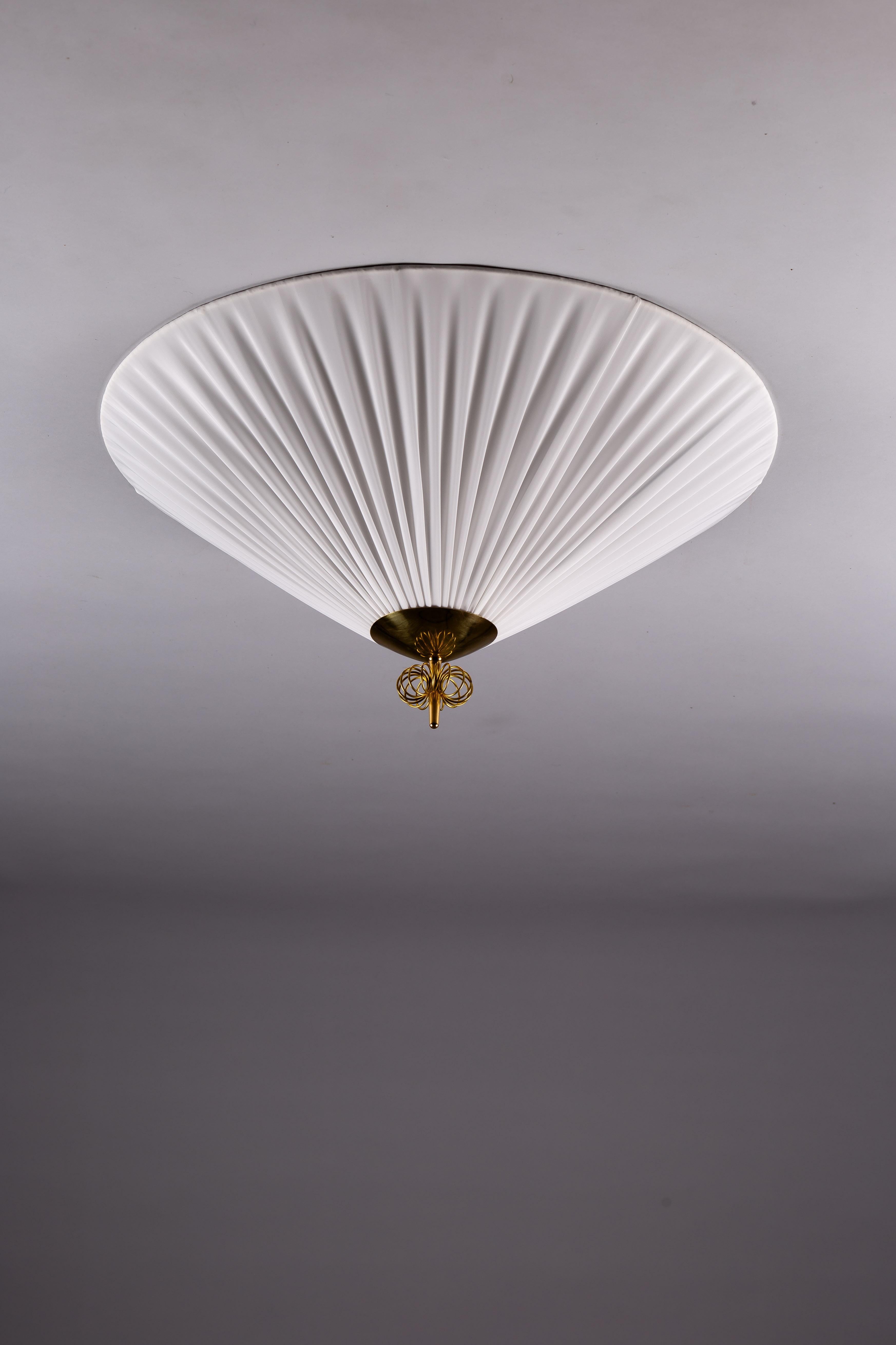 Discover the timeless elegance of the Paavo Tynell 1950's plafond lamp, crafted by Idman Oy, Finland. Celebrate the exquisite craftsmanship and iconic design of Scandinavian Vintage Design. This refined lamp features Tynell's signature blend of