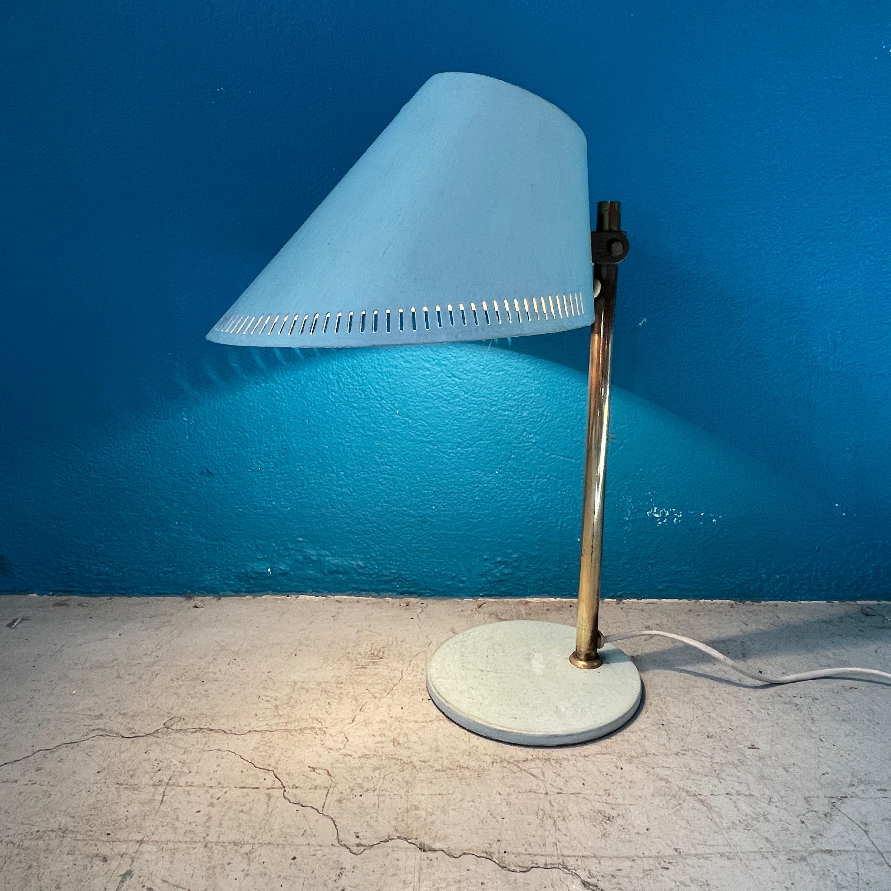 Beautiful and iconic Light Blue colored desk lamp by Paavo Tynell.  

Early version from 1950's, stamped: 