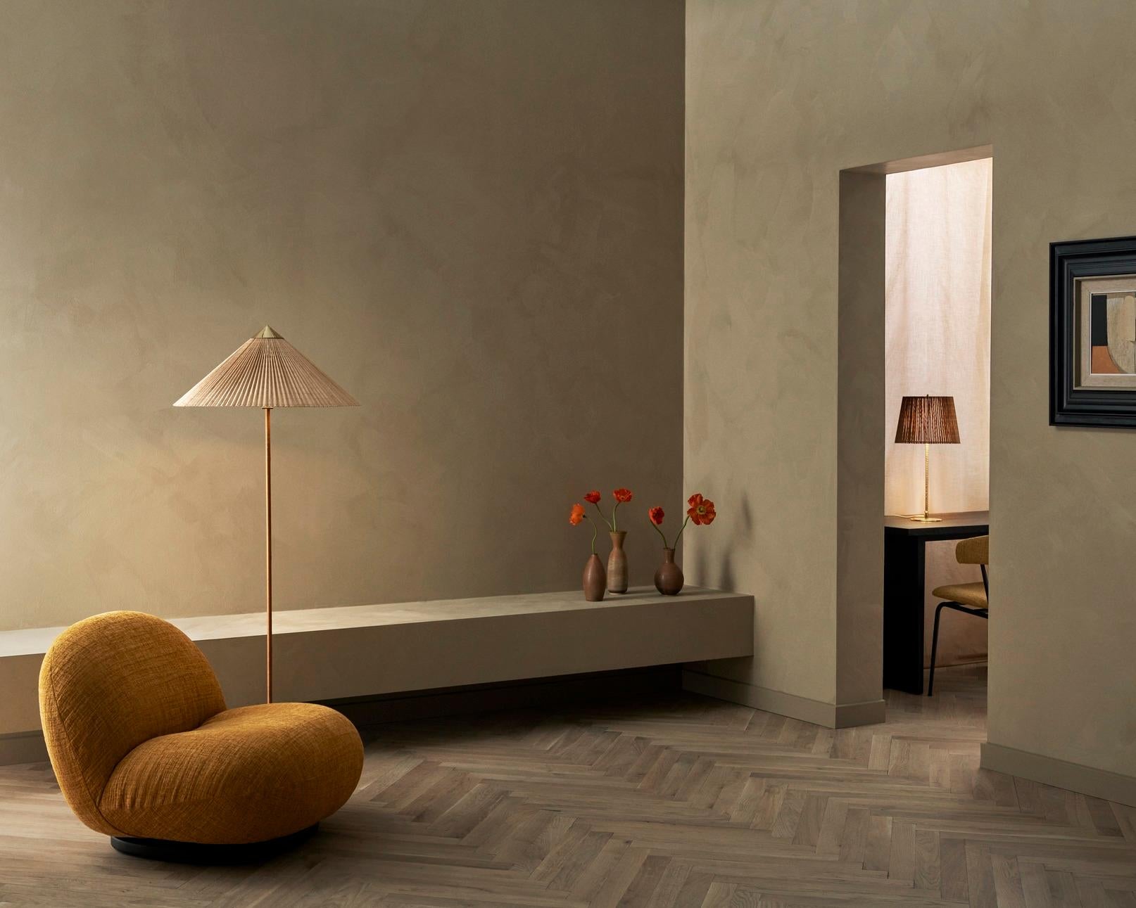 The 9602 Floor Lamp, also known as “Chinese Hat” was designed by Paavo Tynell in 1935 for the hotel Aulanko. Characterized by its elegant and airy lampshade and rattan-covered stem, the 9602 Floor Lamp shows the designer’s limitless imagination and
