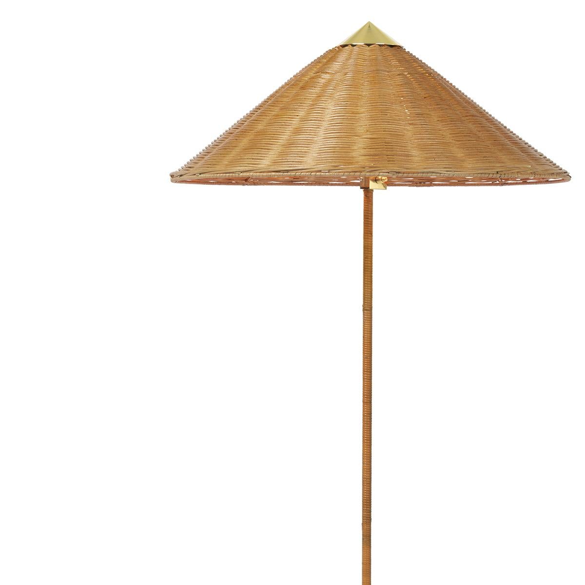 The 9602 floor lamp, also known as “Chinese Hat” was designed by Paavo Tynell in 1935 for the Hotel Aulanko. Characterized by its elegant and airy lampshade and rattan-covered stem, the lamp shows the designer’s limitless imagination and
