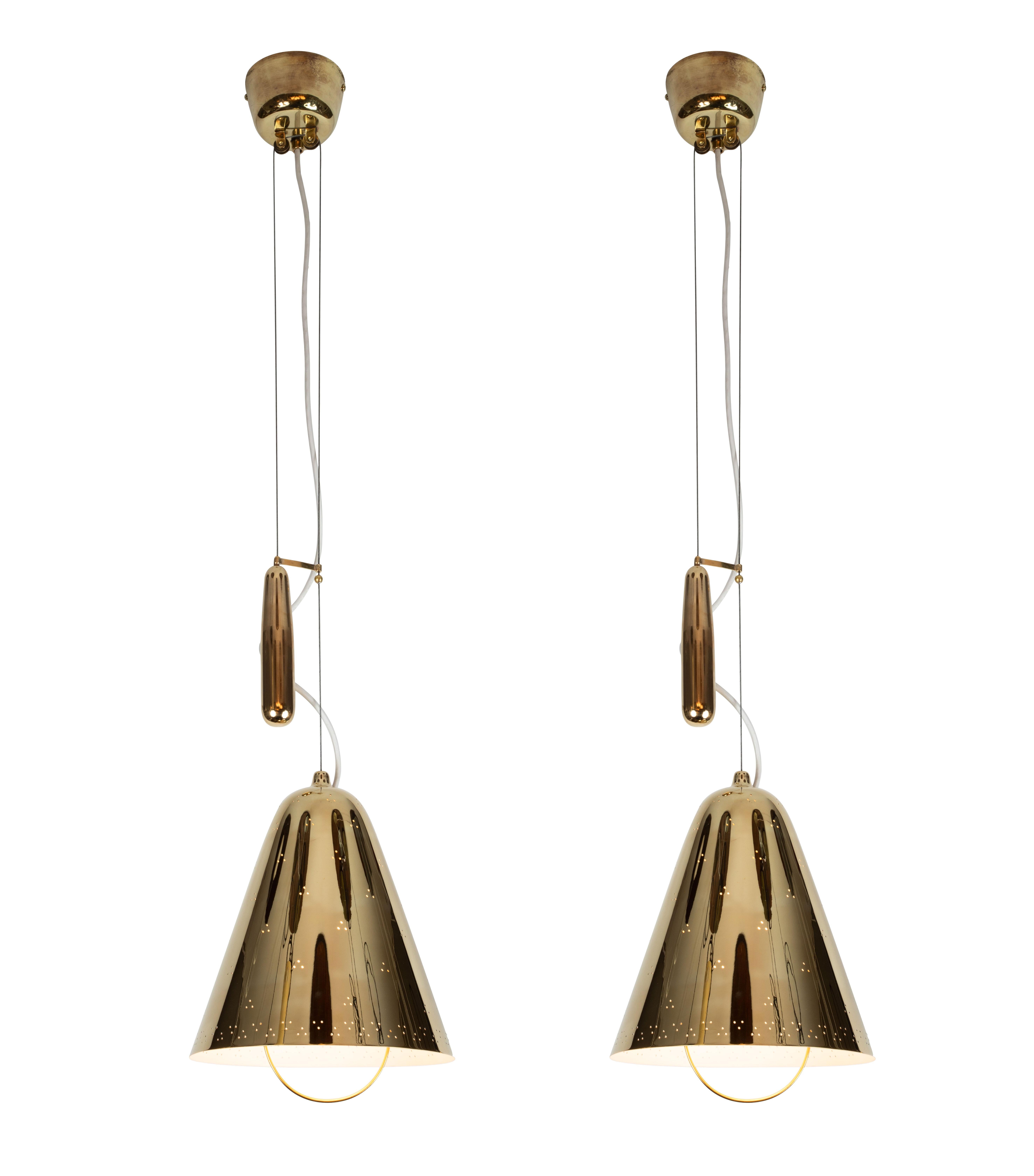 1940s Paavo Tynell 'A1942' counterweight pendant for Taito Oy. This rare and exceptional lamp is executed in brass, and can be raised and lowered using its ingenious counterweight and pulley system. Manufactured by Taito Oy in the early 1950s, this