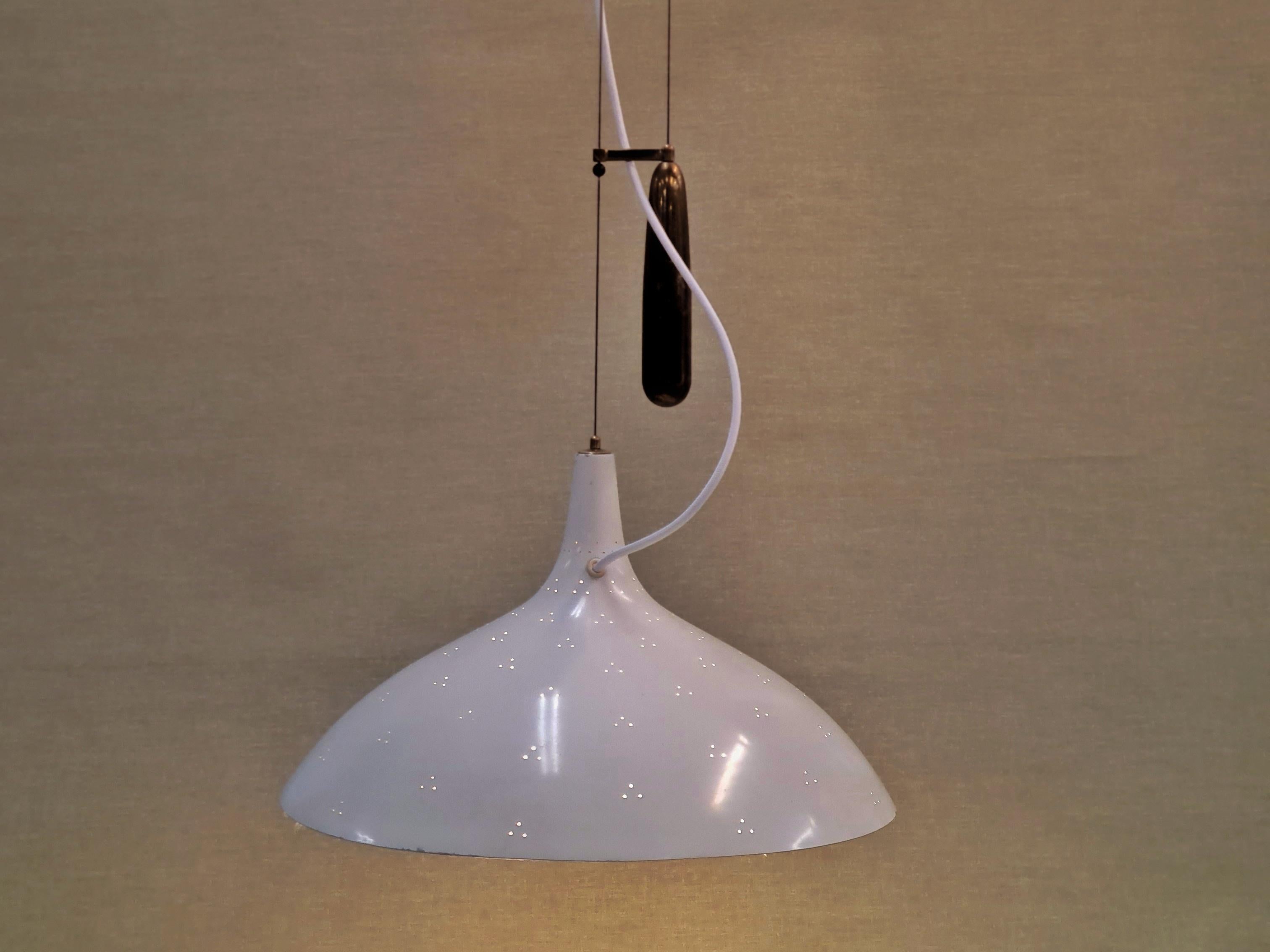 Paavo Tynell created the counter weight lamp design in response to American lamp specifications, that did not allow lamps to hang by electricity cords on their own. The result was a whole series of counter weight lamp designs of which this model,