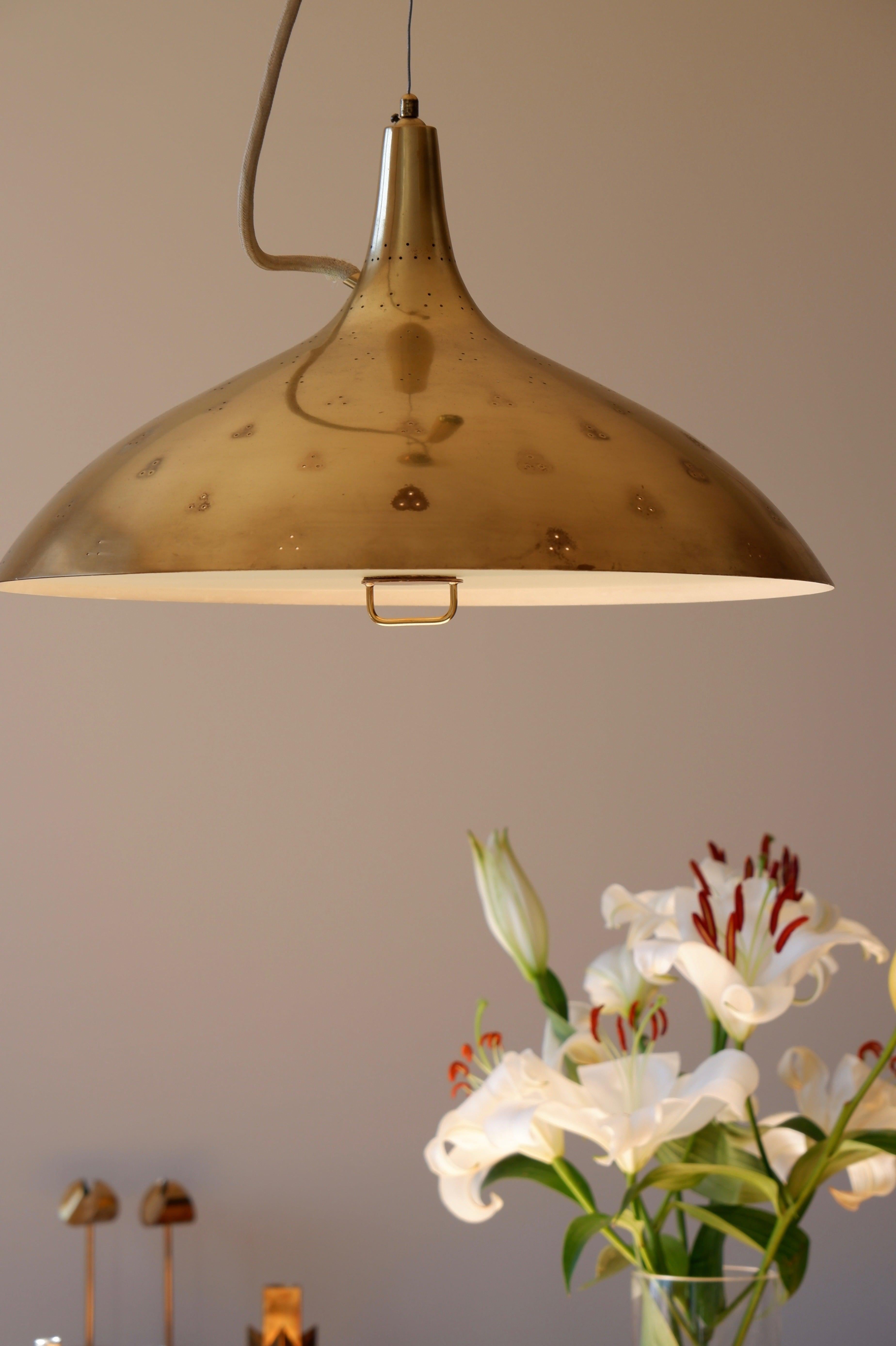 Iconic lamp designed by Paavo Tynell in the 40's and produce by TAITO OY in Finland. This example was manufactured by Taito Oy, which was the first company that Paavo Tynell established already in the 1920s and was known for the highest standards in