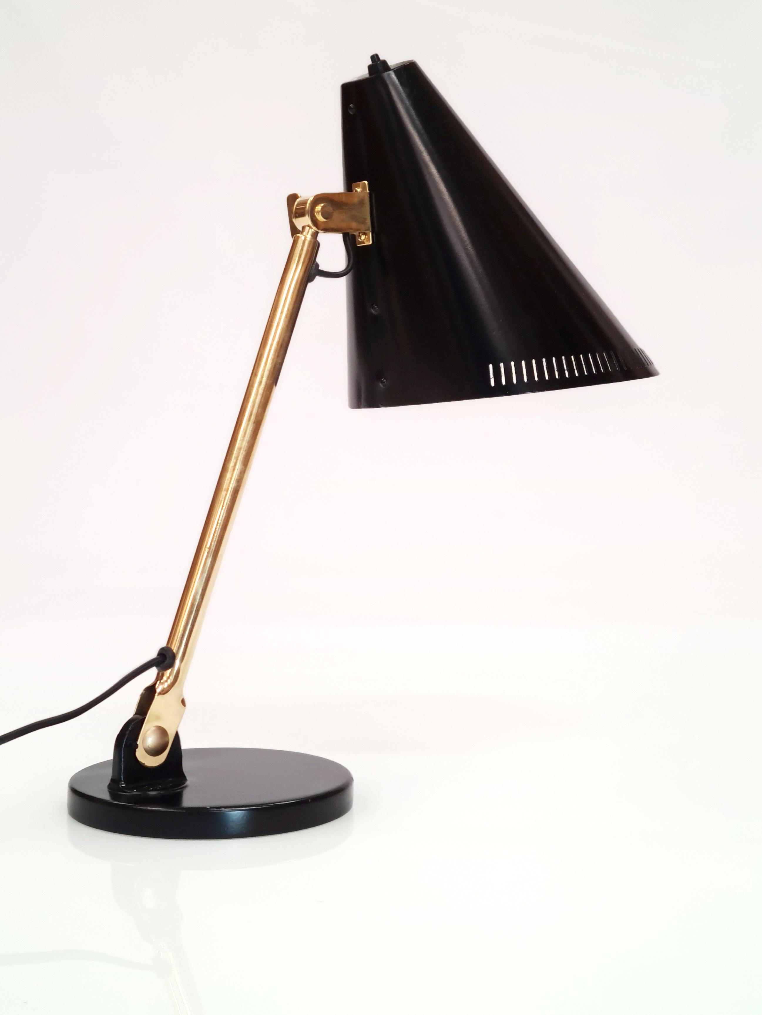 This early table lamp design by Paavo Tynell is well recognized and considered by many as the pivotal point at which a shift in his designs started appearing. It was one of the first designs that had perforations / slits and adjustability in height