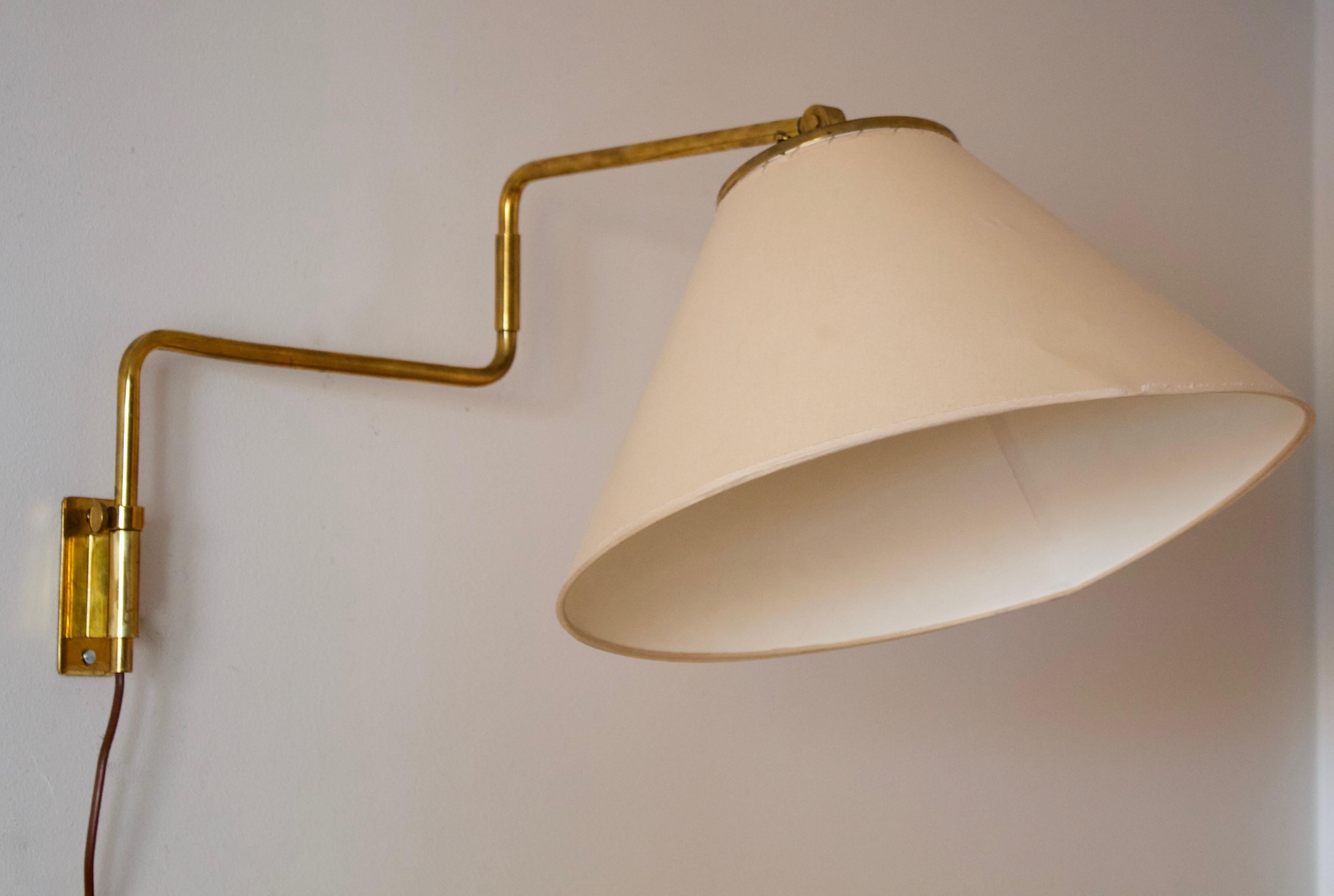 An adjustable wall light / task light. Model 9414, designed by Paavo Tynell for his own firm Taito OY, Finland, 1950s.