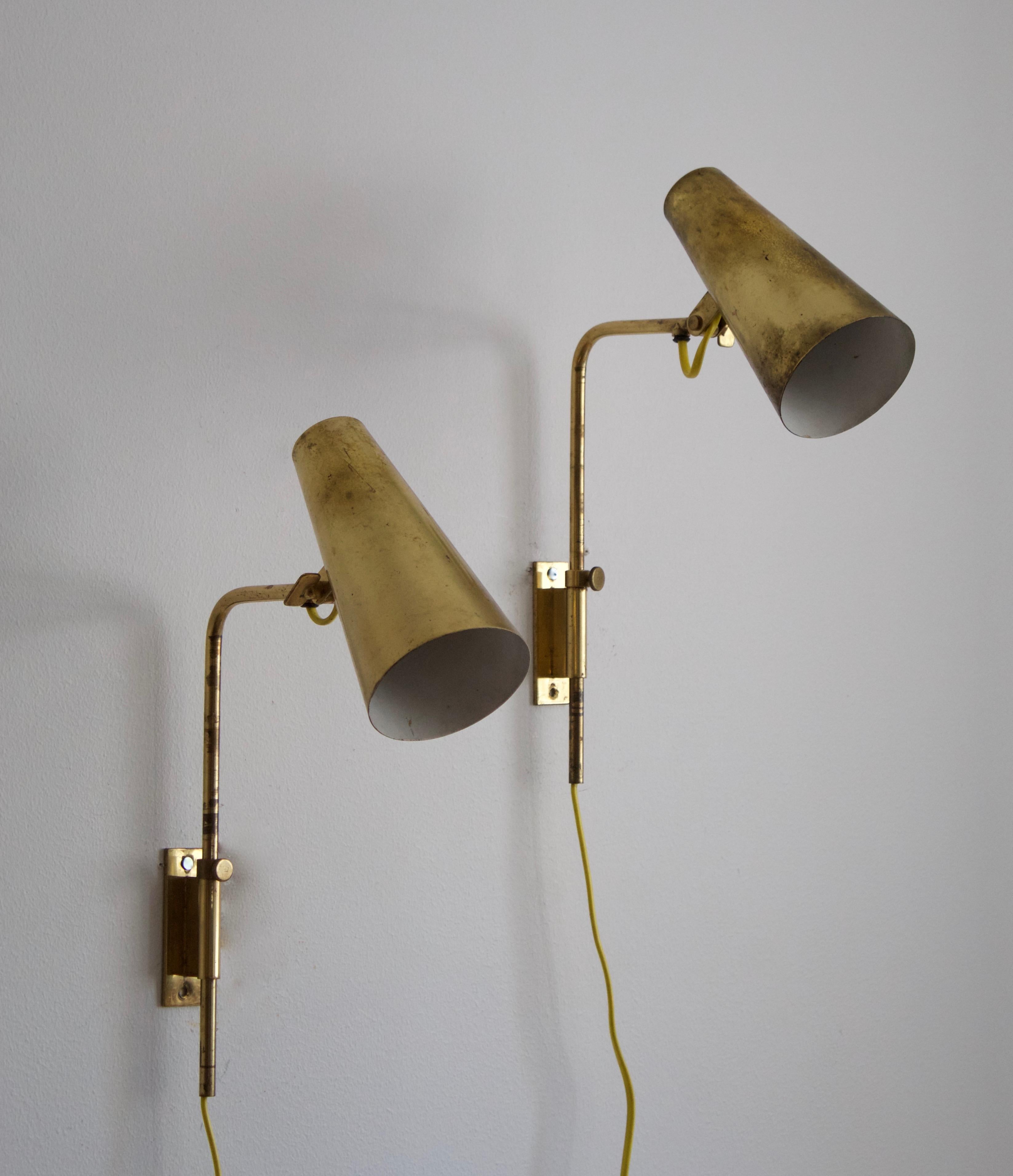 A pair of adjustable wall light / task lights. Model 9459, designed by Paavo Tynell for his own firm Taito OY, Finland, 1950s.