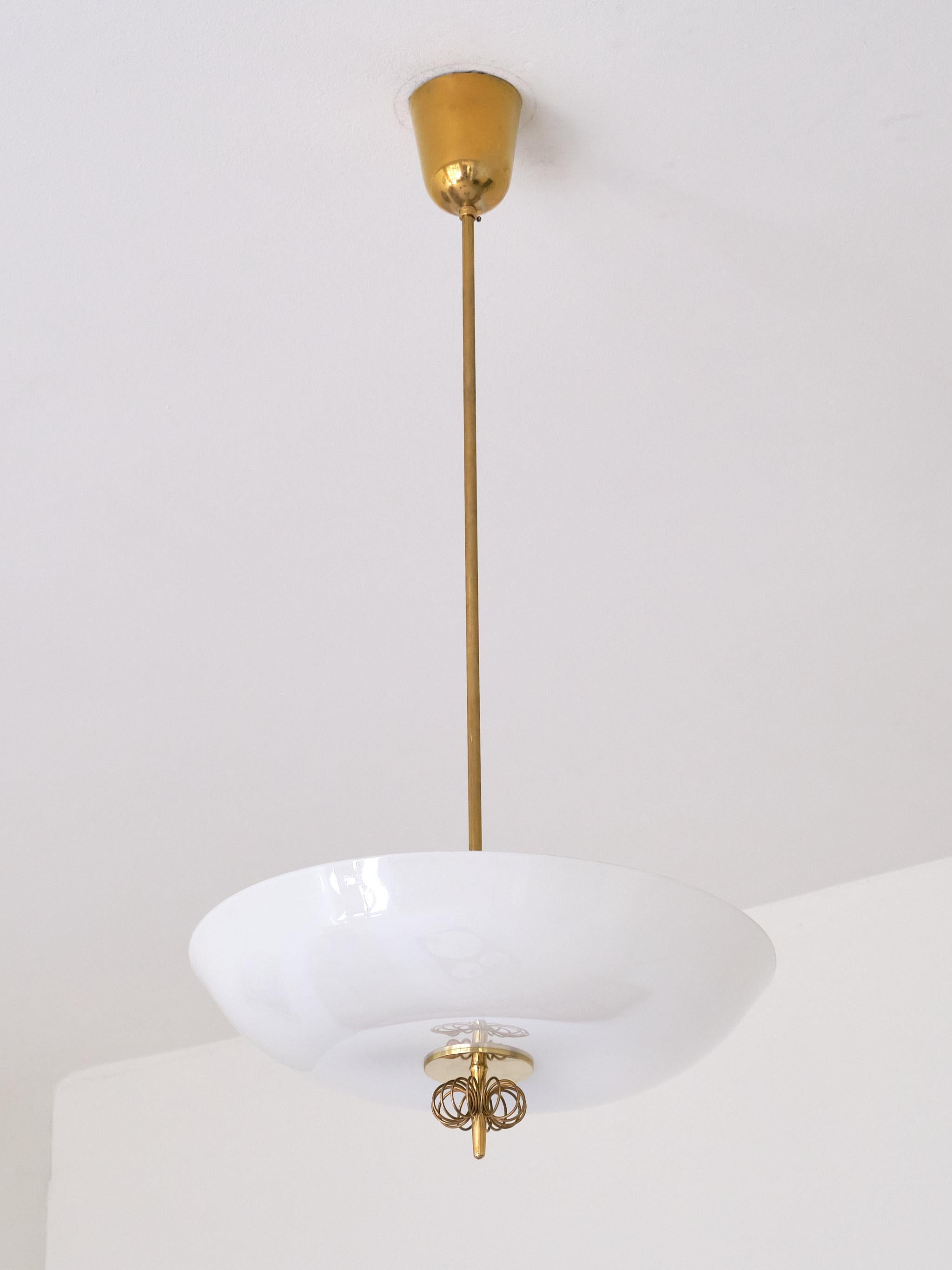 This very rare ceiling/pendant light was designed by Paavo Tynell and produced by Taito in Finland in the late 1940s. This particular model was numbered 1088 and came in ceiling/ flush mount as well as the more rare pendant versions.

The design is