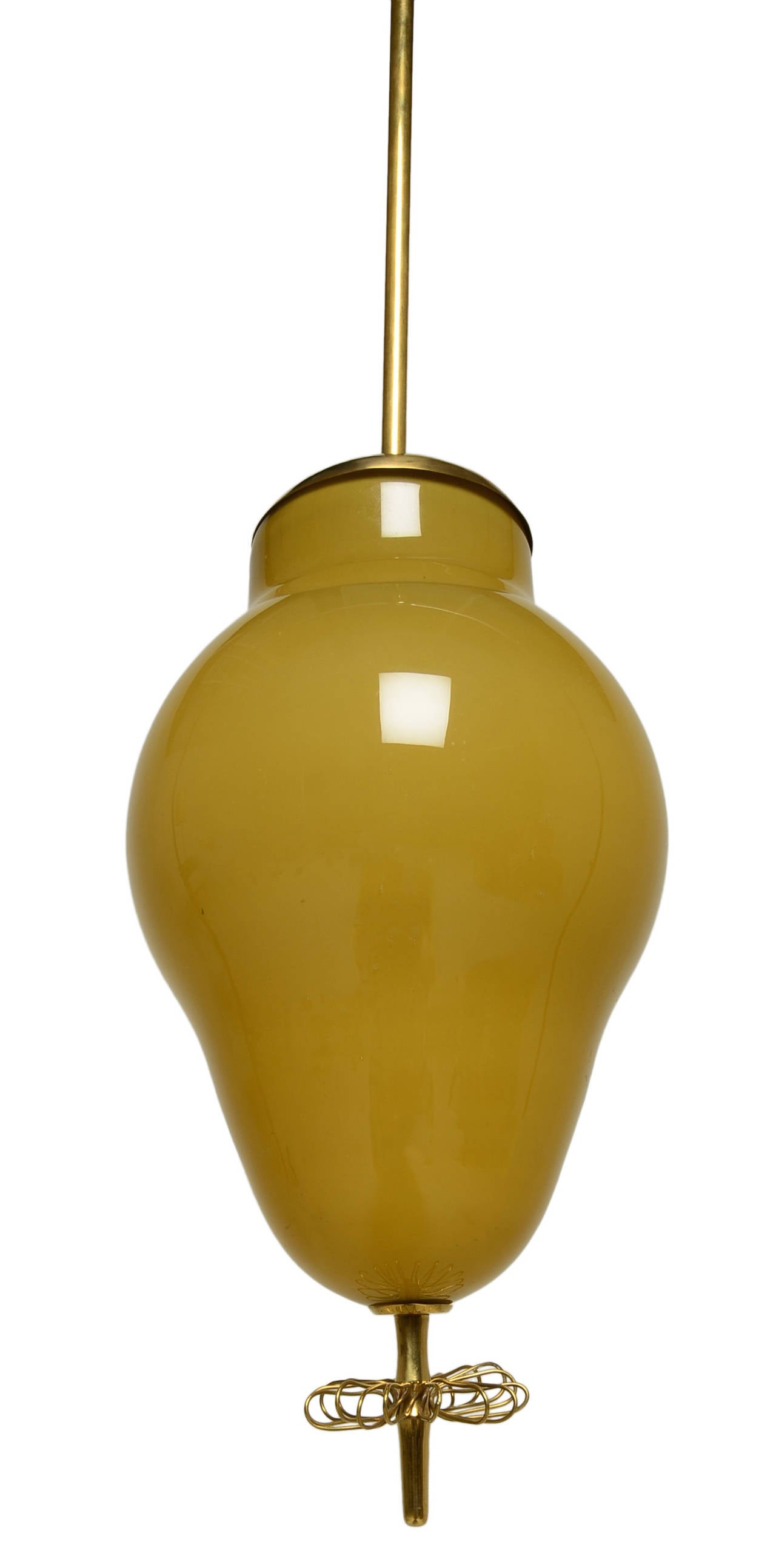 A wonderful hand blown glass and brass drop pendant by Scandinavian master Paavo Tynell for Taito Oy.
Handcrafted and of exceptional quality.

A small jewel-like masterpiece of lighting.
