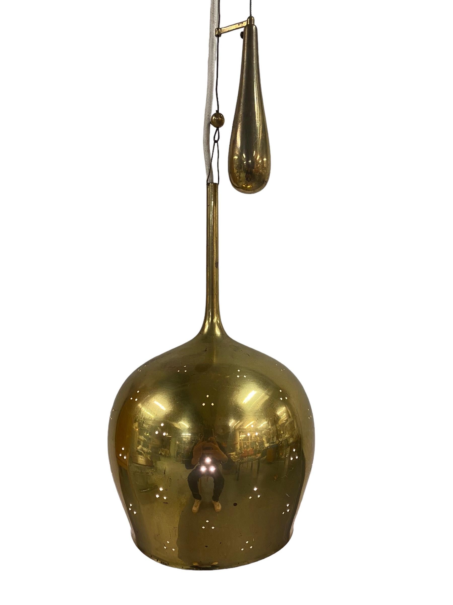 A beautiful and rare ceiling lamp in full brass. Designed by Paavo Tynell and manufactured by Taito Oy in Finland in the 1950s. This is one of Tynells nicest and most recognizable models. The iconic design of this lamp immediately catches your eye.