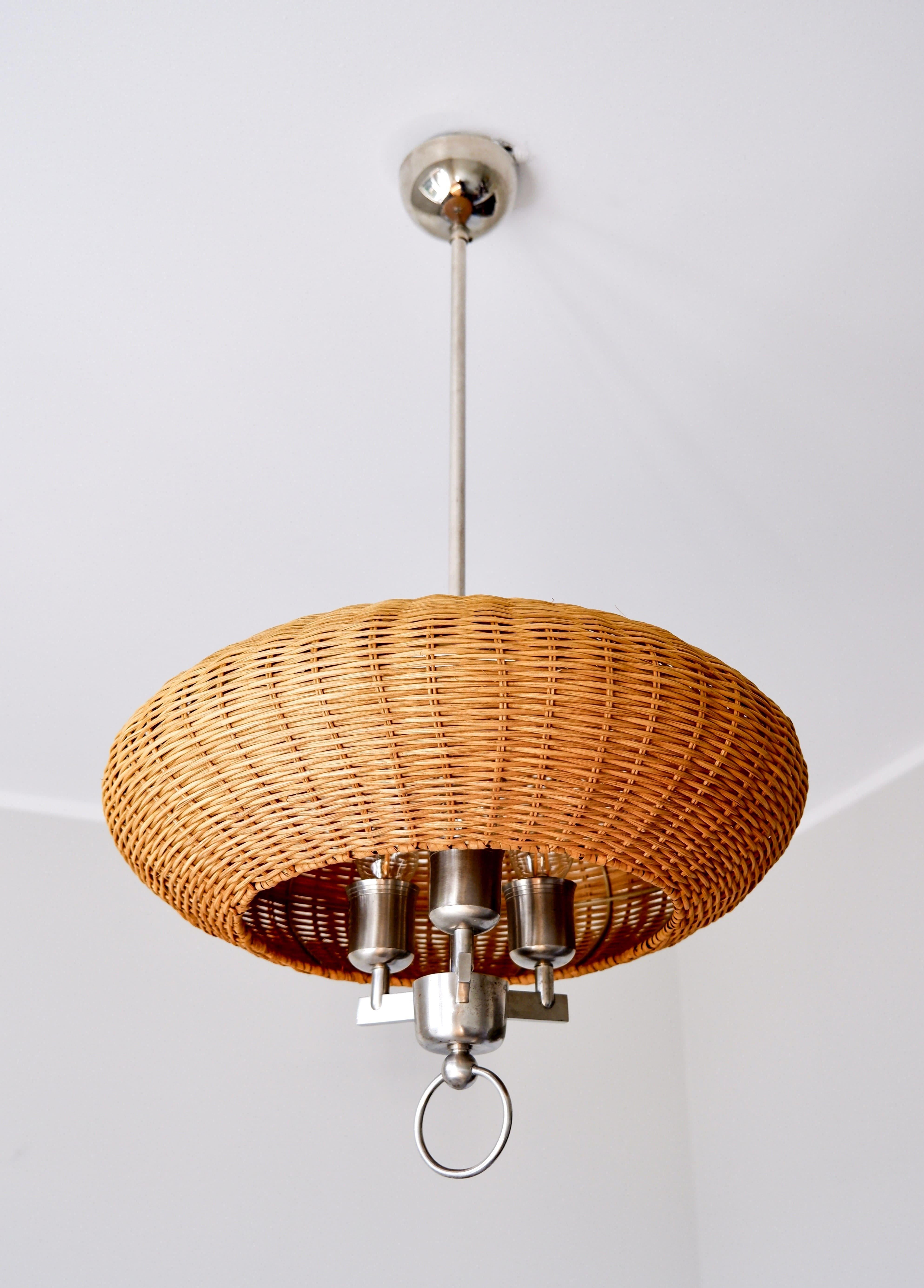 Paavo Tynell ceiling lamp made by Taito in the 40's. The lamp is made in Nikel plated brass with a wood strip shade which has been replace from the original shade. This model is one of the first ever design by Paavo Tynell during the 40's. The lamp