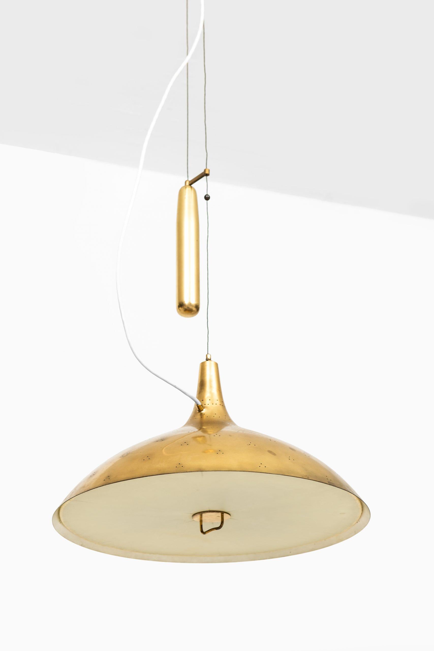 Rare ceiling lamp model A1965 designed by Paavo Tynell. Produced by Taito Oy in Finland.
Measures: Height 105-160 cm.
   