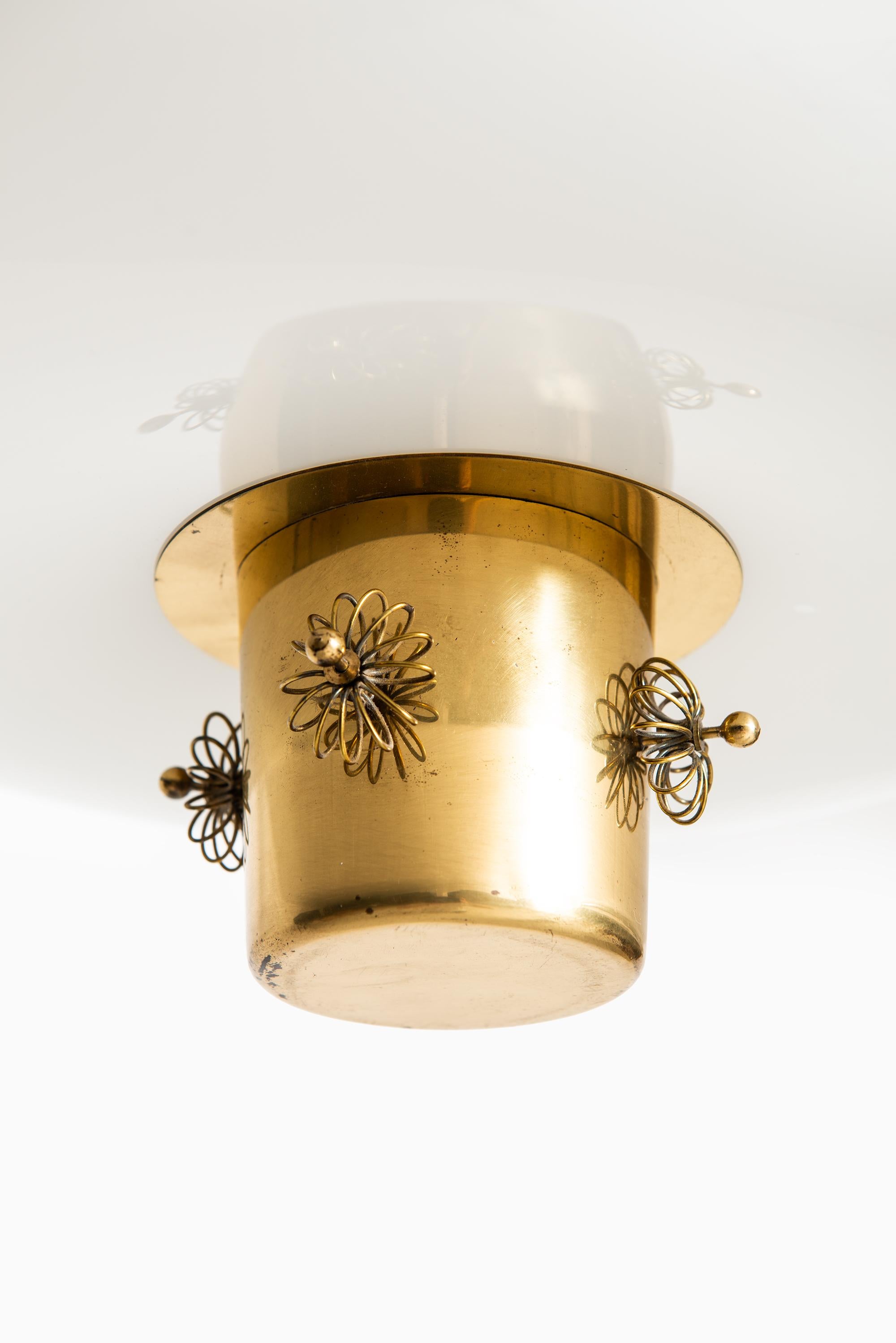 Rare ceiling lamp designed by Paavo Tynell. Produced by Taito in Finland.