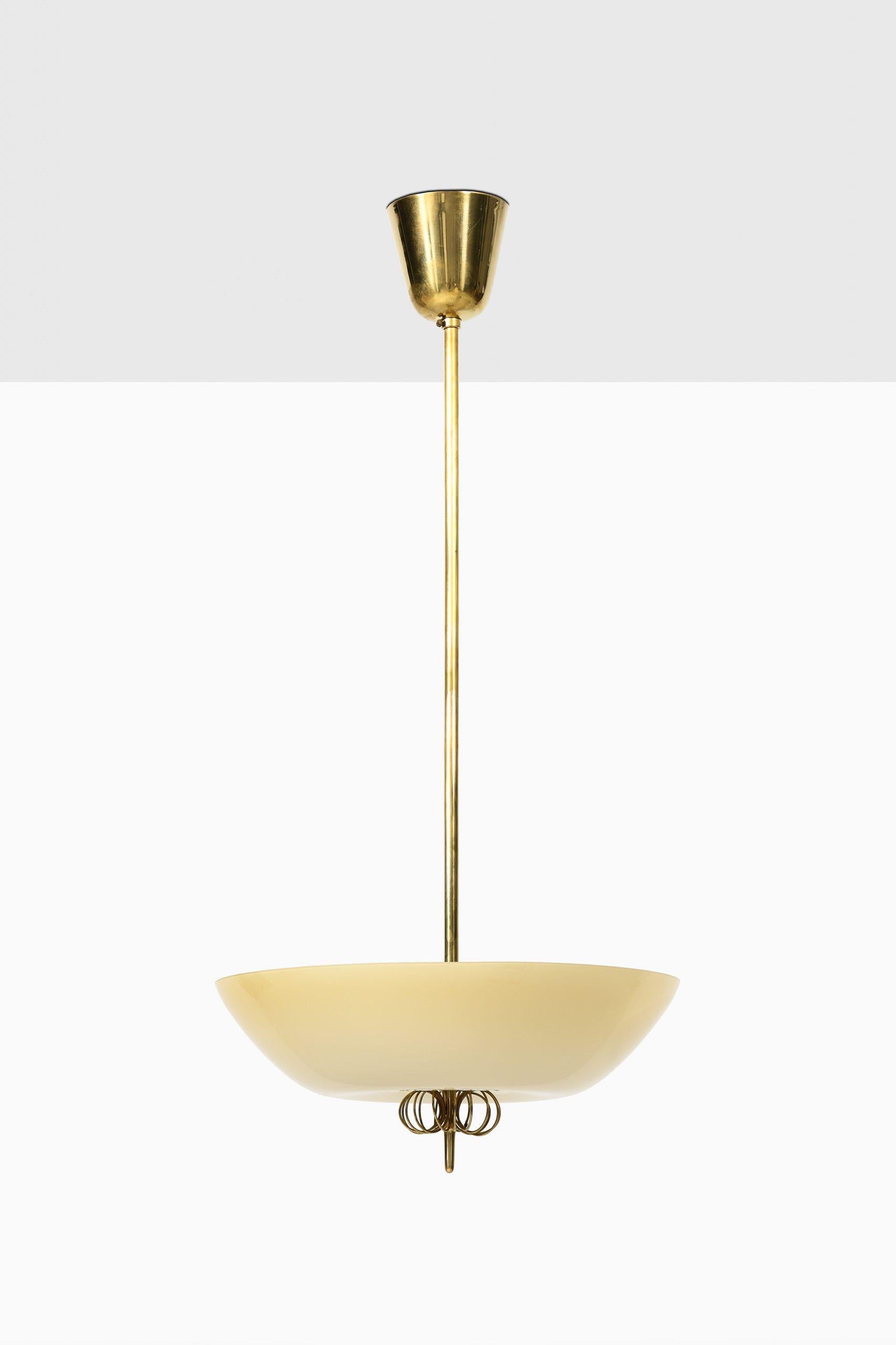 Rare ceiling lamps designed by Paavo Tynell. Produced by Taito Oy in Finland.