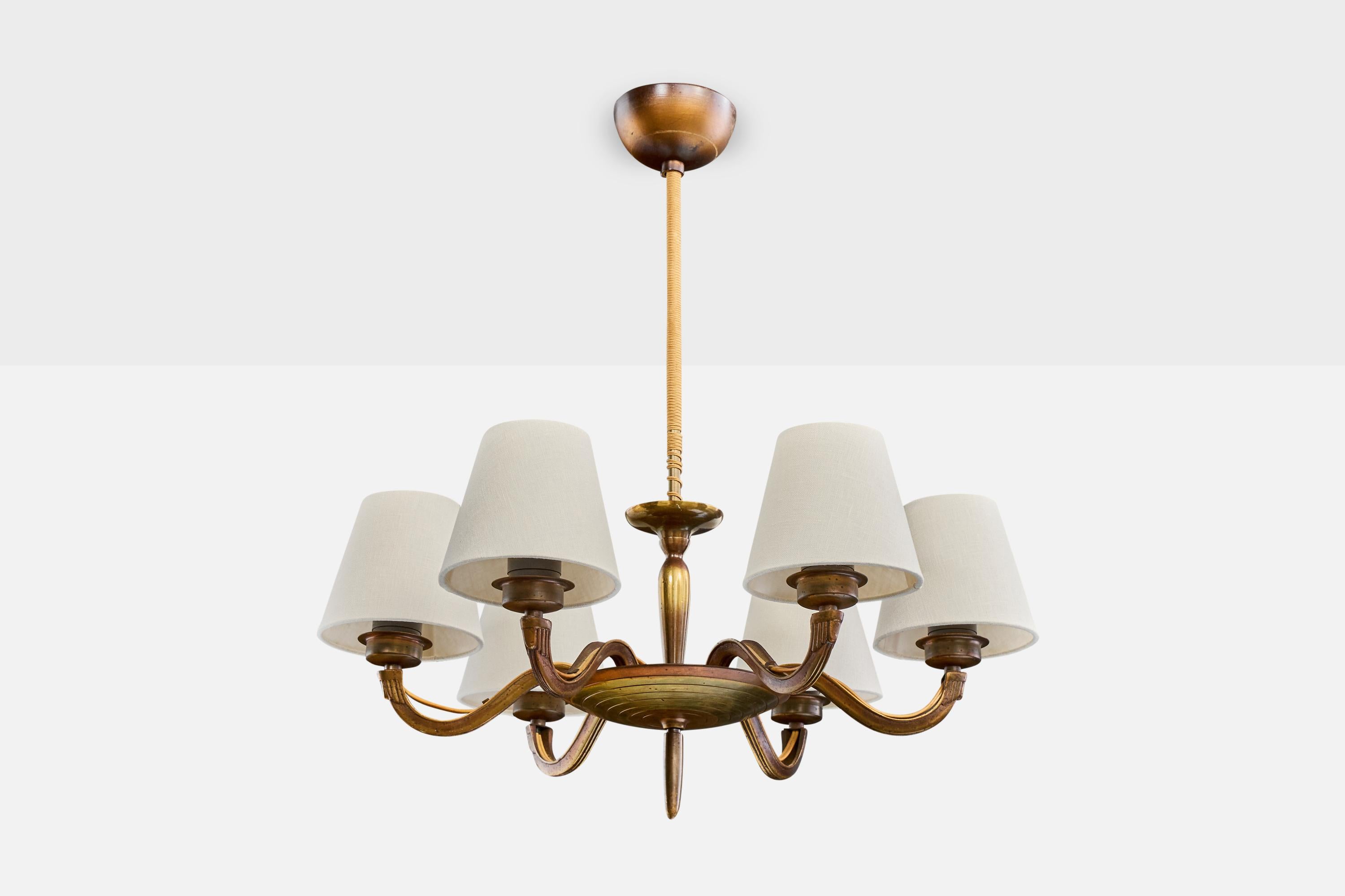 A brass, white fabric and beige fabric cord chandelier designed by Paavo Tynell and produced by Taito Oy, Finland, c. 1930s.

Overall Dimensions (inches): 23.0