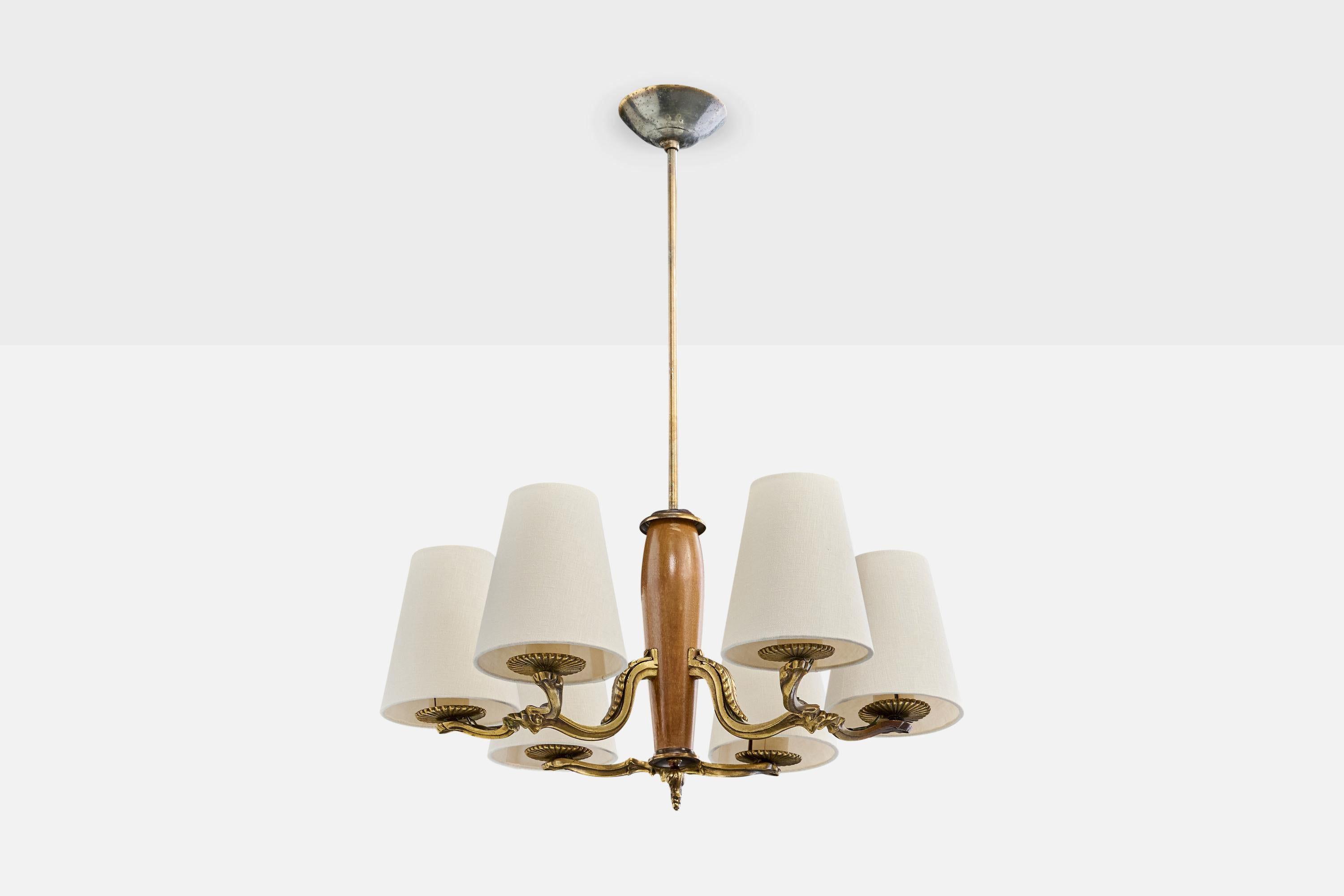 A brass, fabric and wood chandelier, model 1855, designed by Paavo Tynell and produced by Taito OY, Finland, c. 1930s.

Discoloration present to canopy.

Overall Dimensions (inches): 28.0
