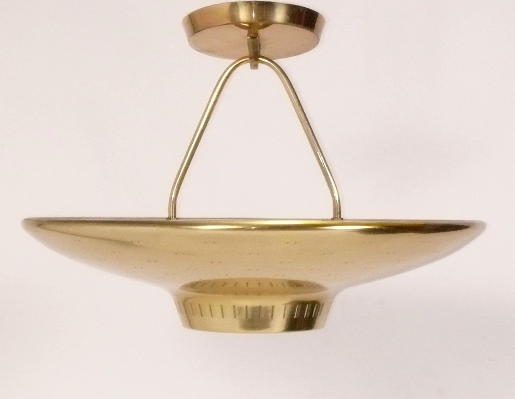 Elegant Mid Century Chandelier, designed by Paavo Tynell for Lightolier, American, circa 1950s. It measures 20.5