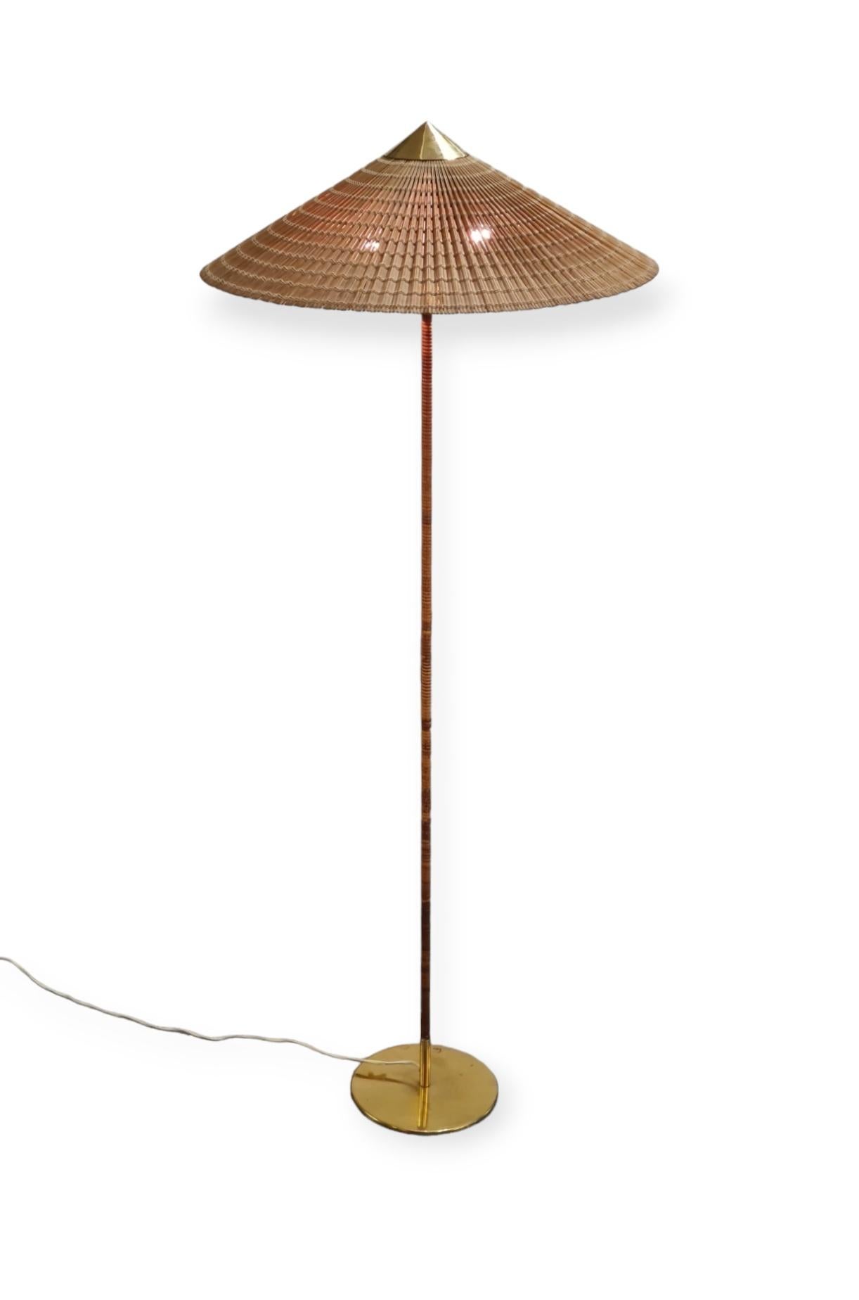This iconic floor lamp was originally designed by Paavo Tynell in the late 1930s and has been refined during the golden era of the Tynell design in the second half of the 1940s. This exquisite lamp still retains all of the original parts except for