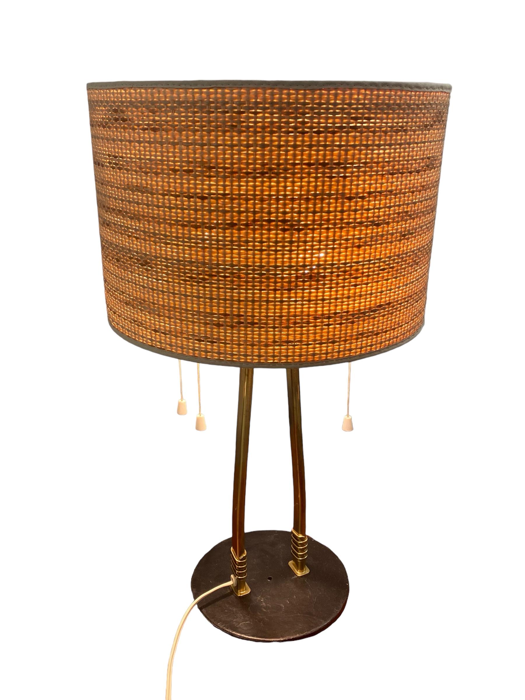 A very rare comissioned table lamp designed in the early 1950s for Taito Oy. This design has been used in a similar yet smaller table lamp in the iconic Vaakuna hotel that was exclusively designed by Tynell (the lighting). It has a metal base