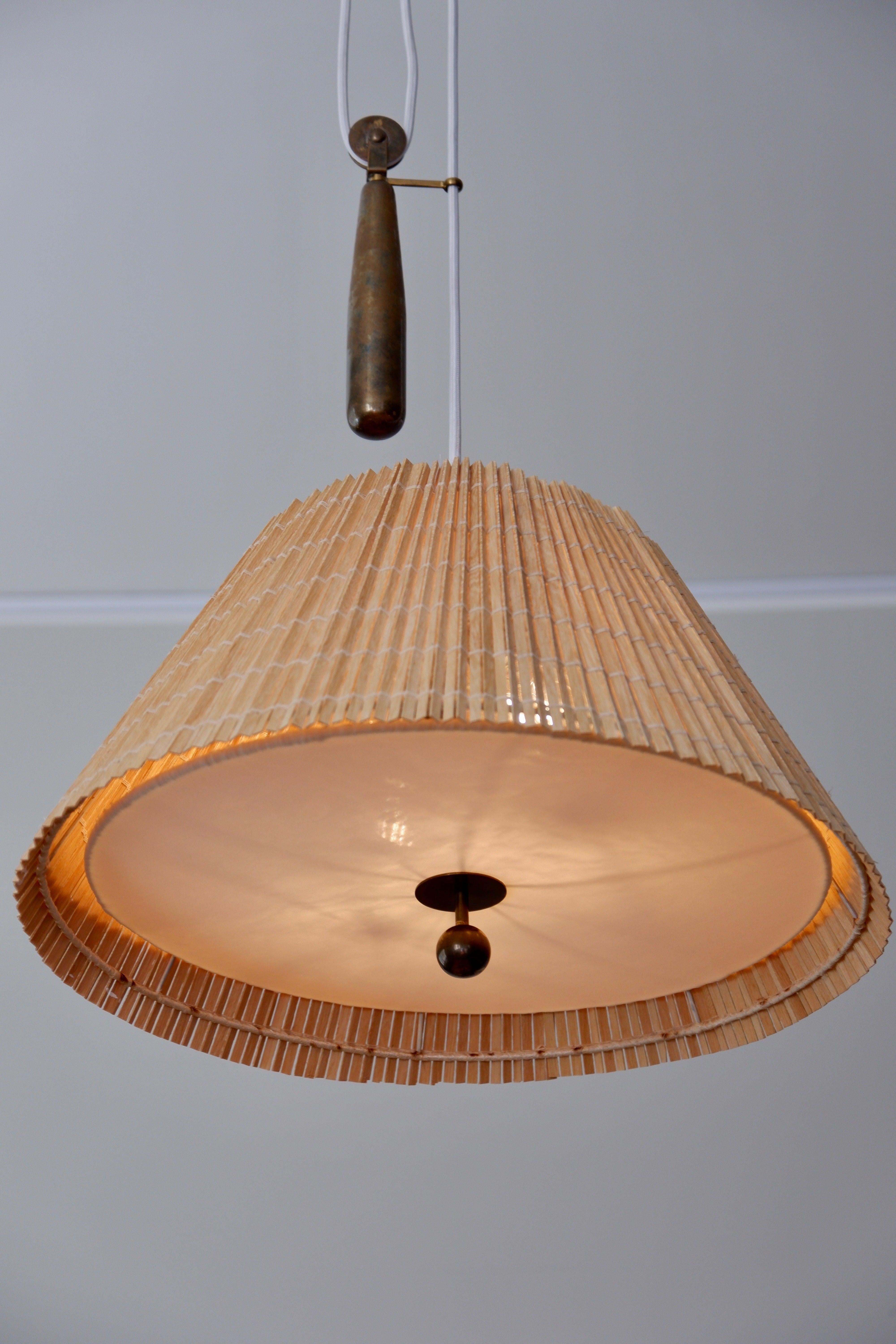Brass Paavo Tynell counter weight pendant light model 1968 TAITO Oy. 