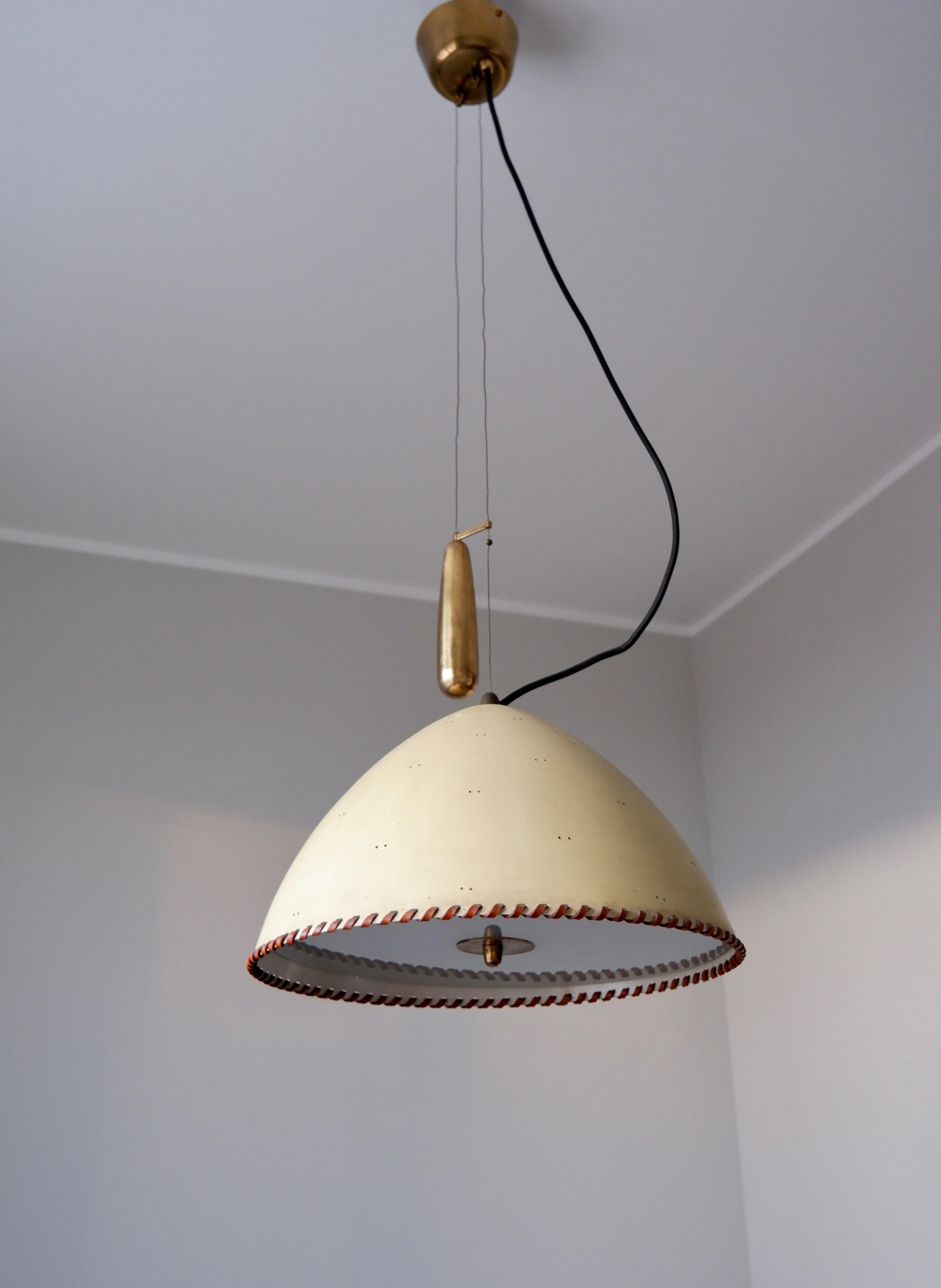 Extremly rare pendant light model A 1983 designed by Paavo Tynell in the 40's and produced by TAITO OY in the same time. The lamp has its original painting on shade, with a rounded leather circle on the bottom of it. The counter weight system is