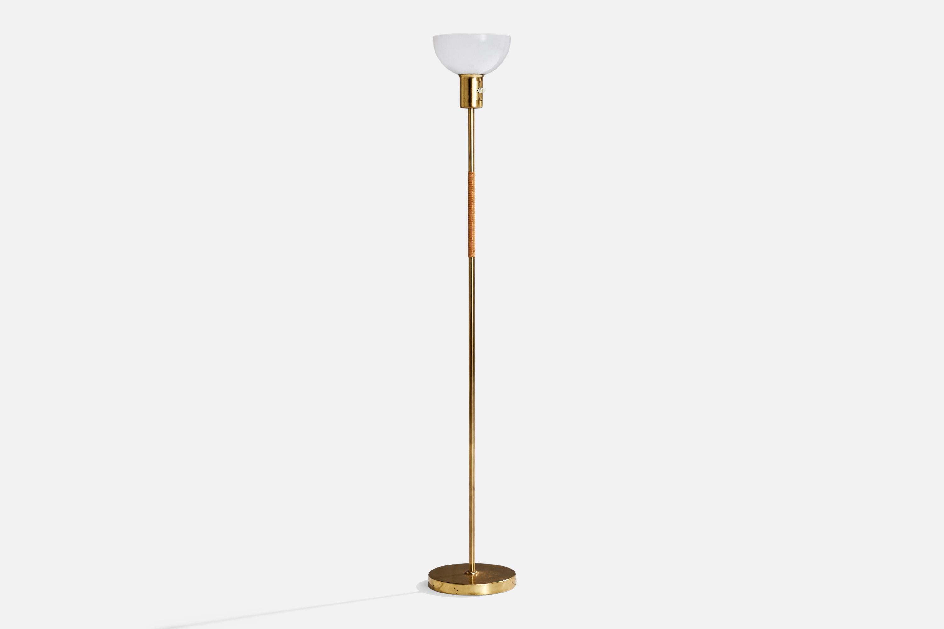 A brass, rattan and white opaline glass floor lamp designed by Paavo Tynell and produced by Idman, Finland, 1950s.

Dimensions of Lamp with Shade (inches):  56.25“ H x  9.25“ Diameter

Bulb Specifications: E-26 Bulb

Number of Sockets (per fixture):
