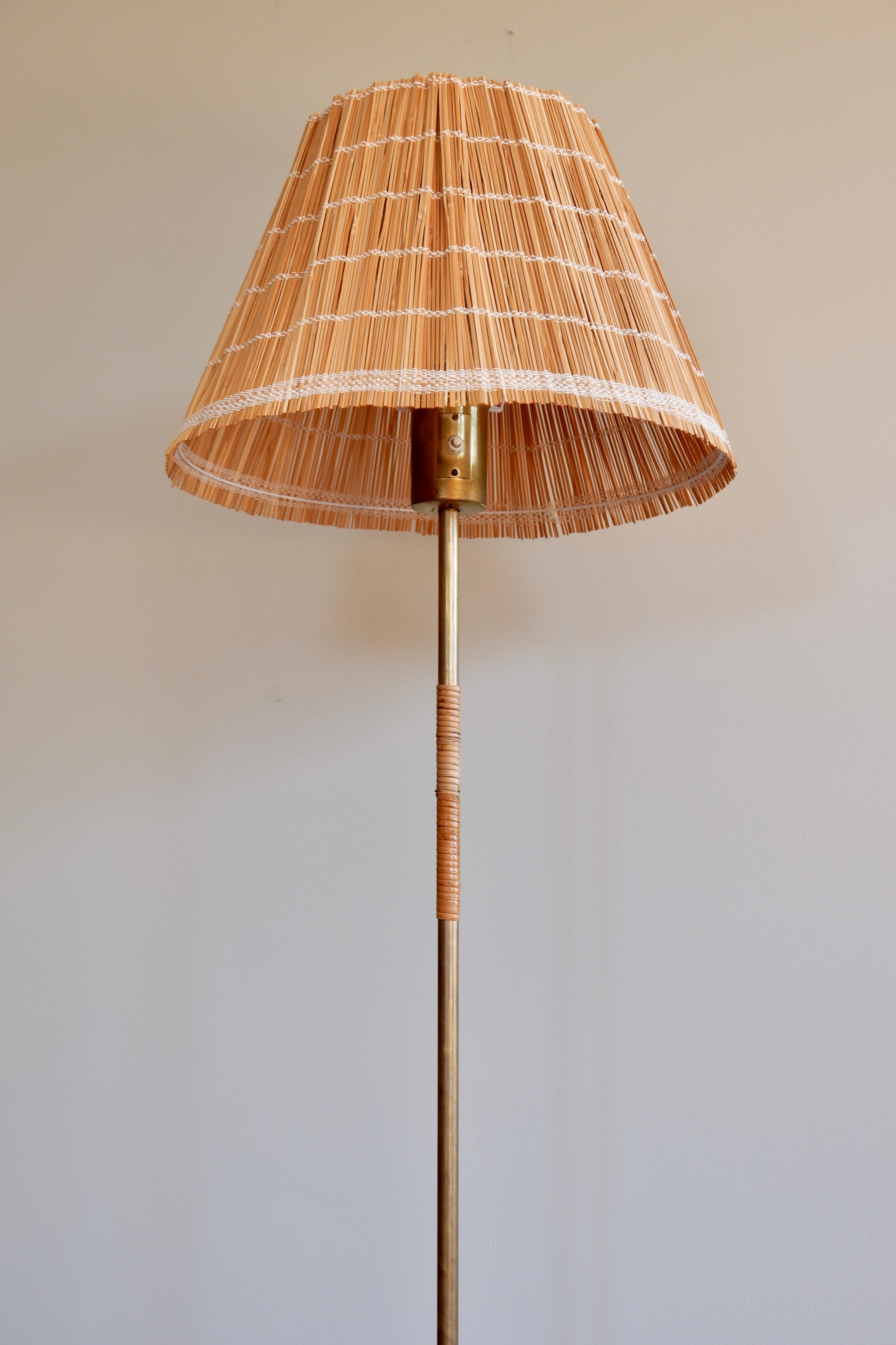 Finnish Paavo Tynell Floor Lamp Model K10-13 for Idman circa 1950, Brass & Rattan For Sale