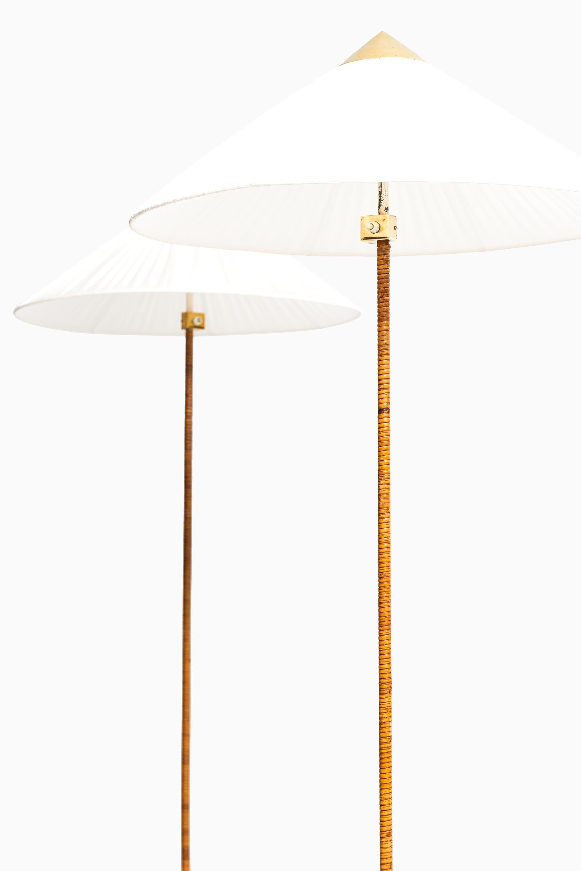Very rare pair of floor lamps model 9602 / Chinese hat designed by Paavo Tynell. Produced by Taito Oy in Finland.