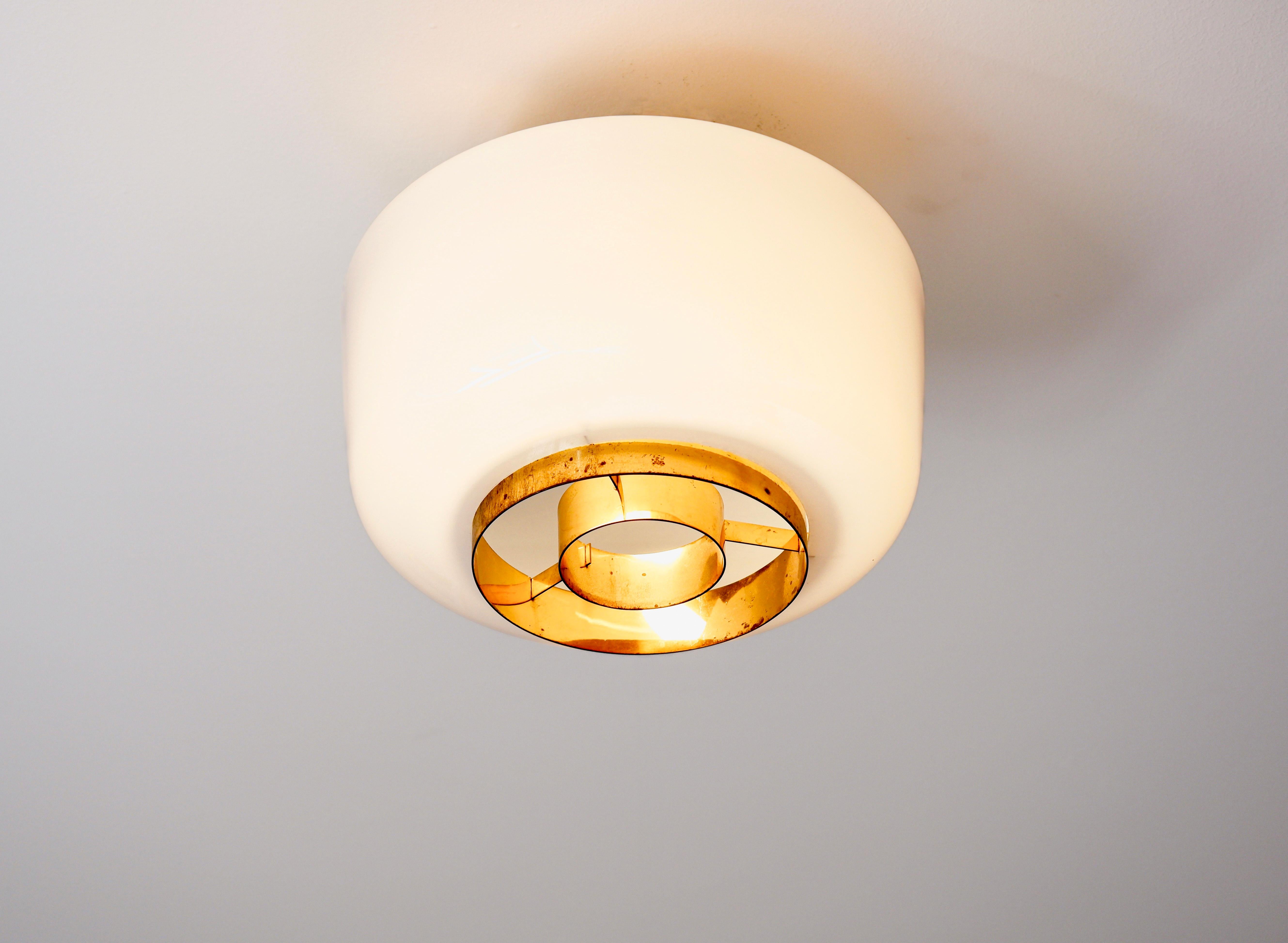 Mid-20th Century Paavo Tynell flush mount model A2-7 for Idman, brass & opal glass, circa 1960. For Sale
