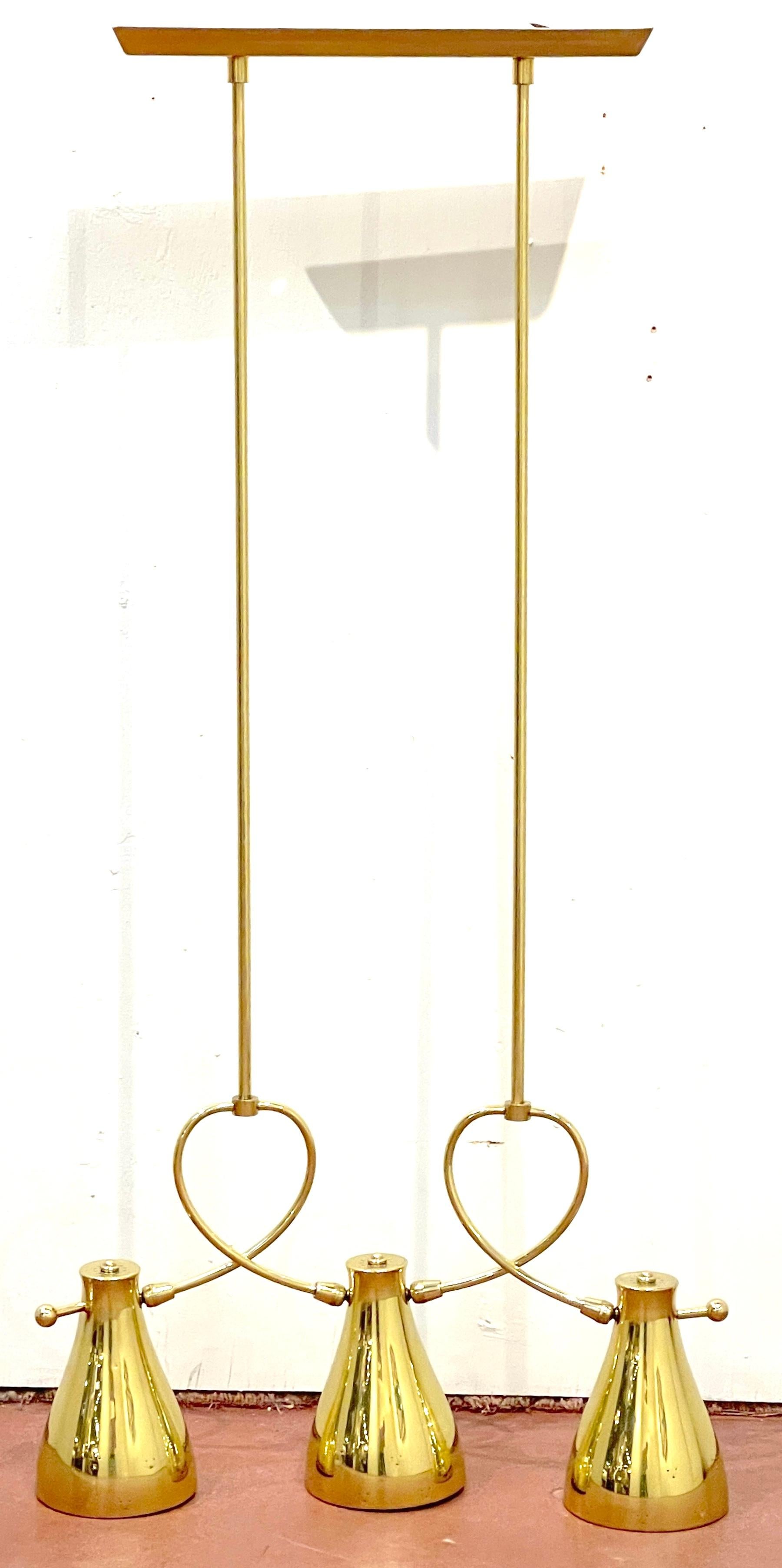 Paavo Tynell for Lightolier, Large Brass Pendant Lamp/Chandelier, 1950s
USA, 20th century

An exceptional design, this Paavo Tynell for Lightolier Large Brass Pendant Lamp/Chandelier is a true gem from the mid-20th century. Designed with tailored